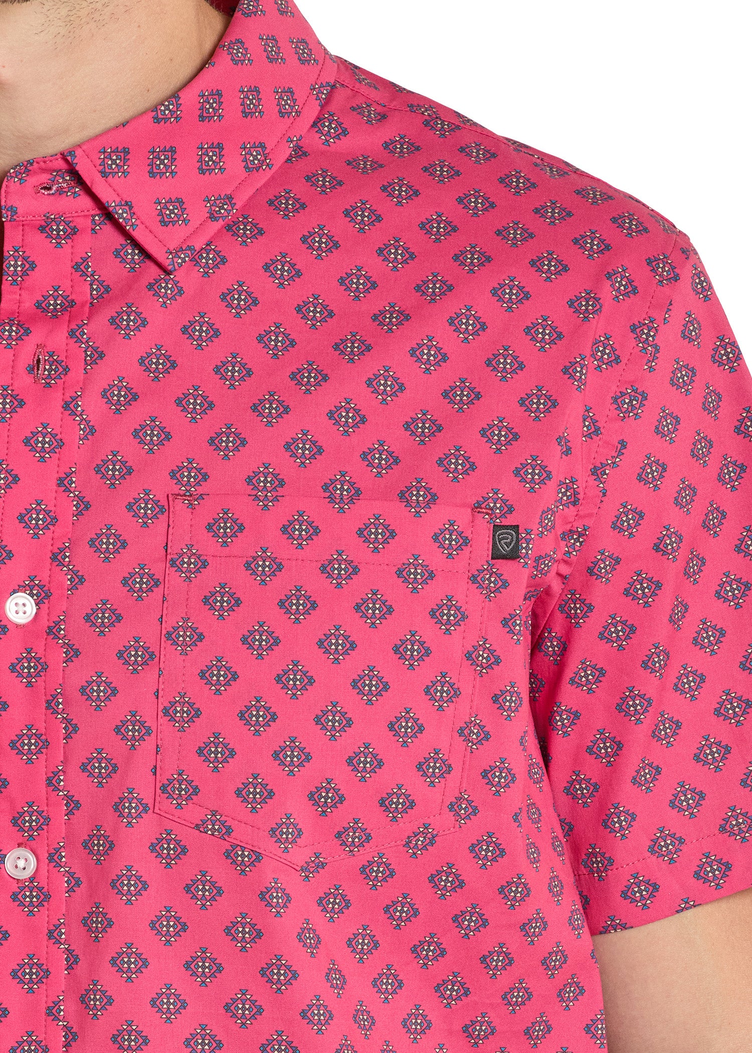 Close-up of a pink patterned shirt worn by a person