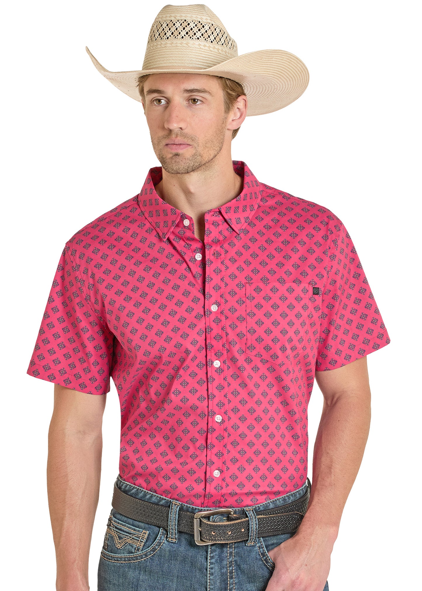 Man wearing a pink patterned shirt and cowboy hat on a white background