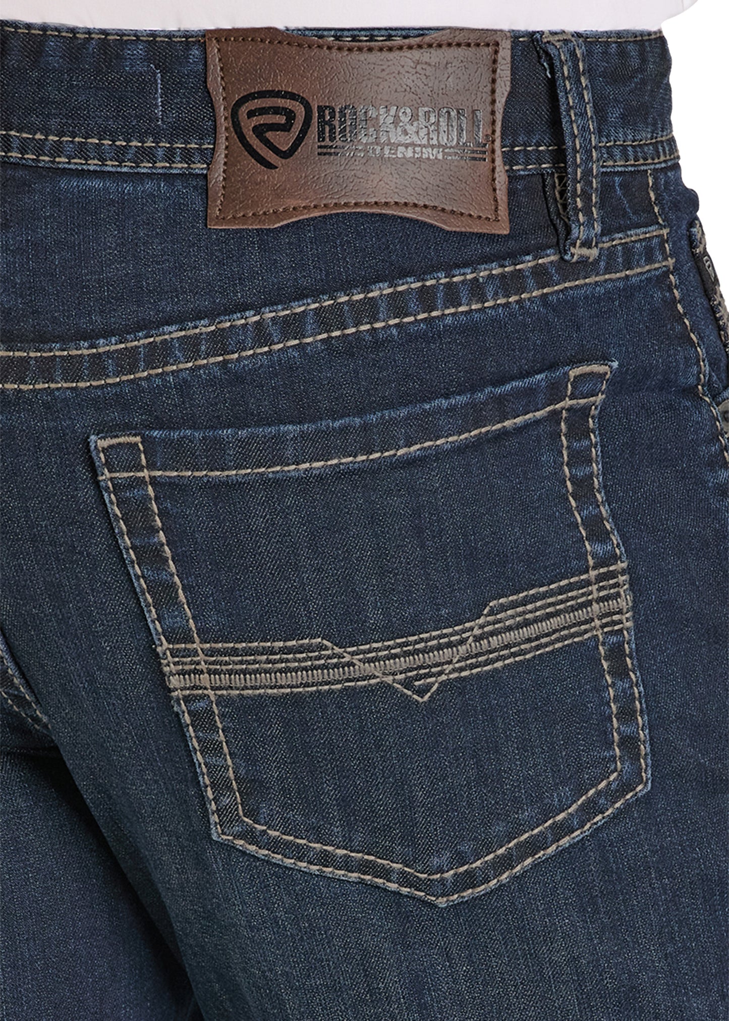 Close-up of blue jeans with a brown label on a white background