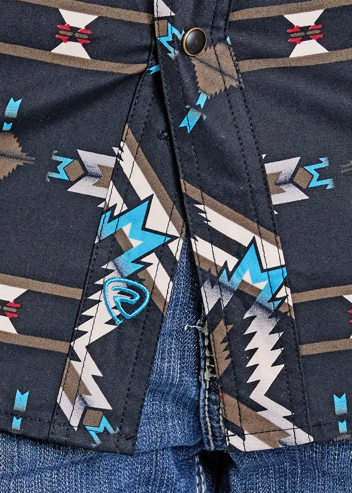 Close-up of a shirt with a geometric pattern on a dark blue background