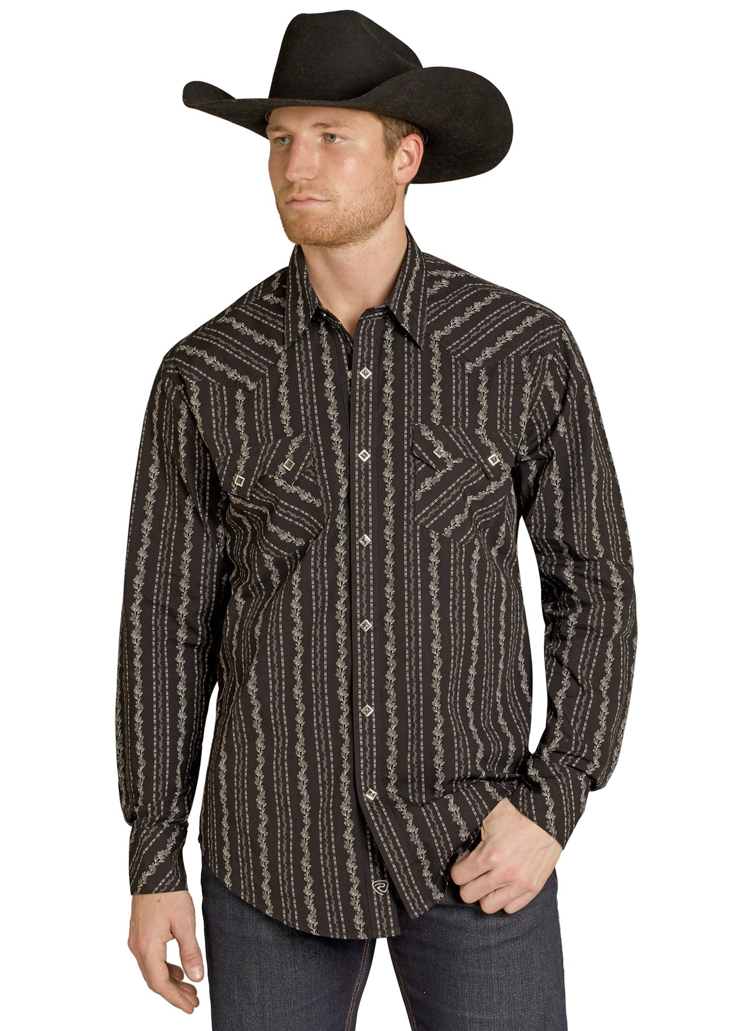 Man wearing a patterned long-sleeve shirt and black cowboy hat on a white background