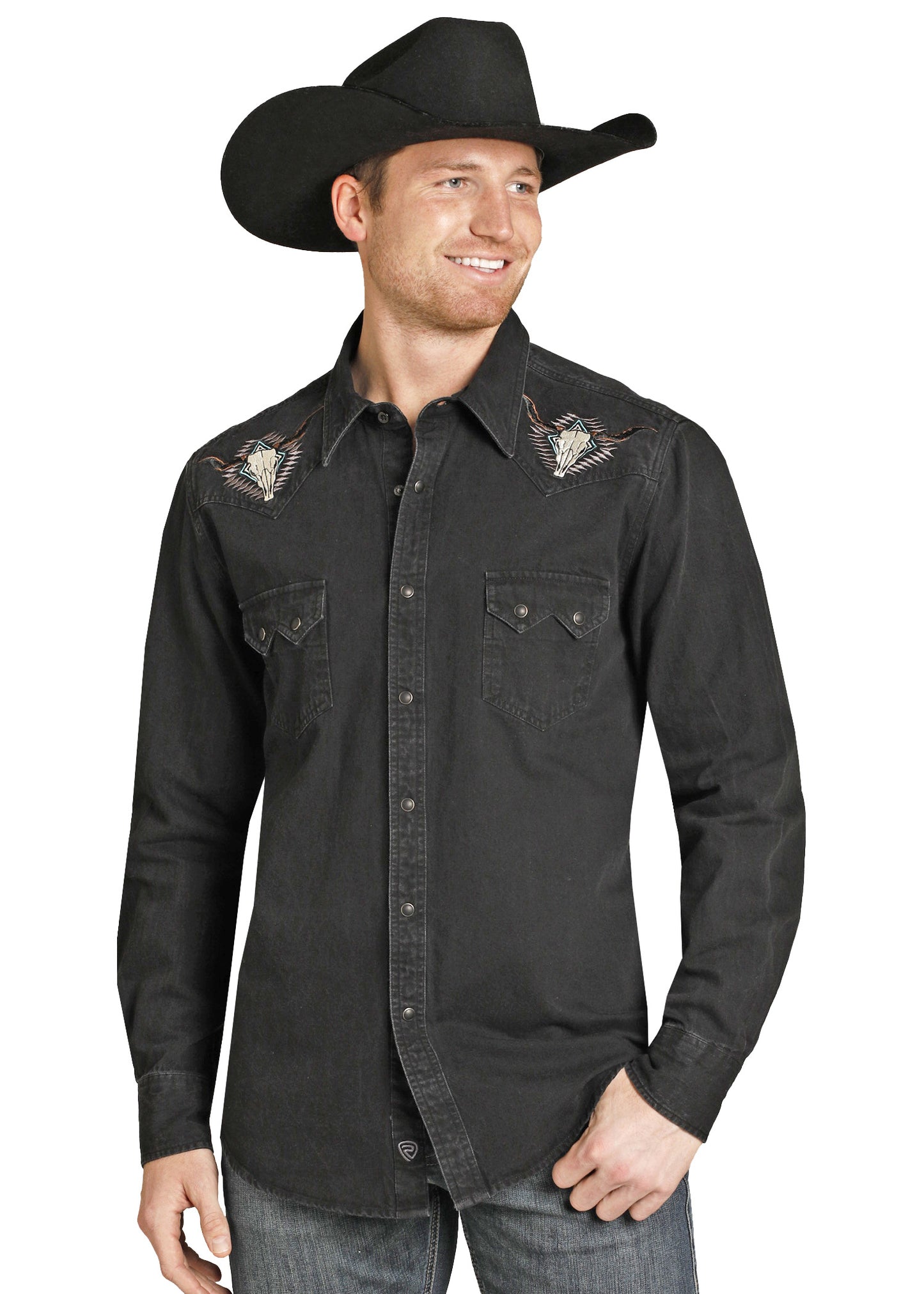 Man wearing a black cowboy hat and black shirt with eagle designs on a white background