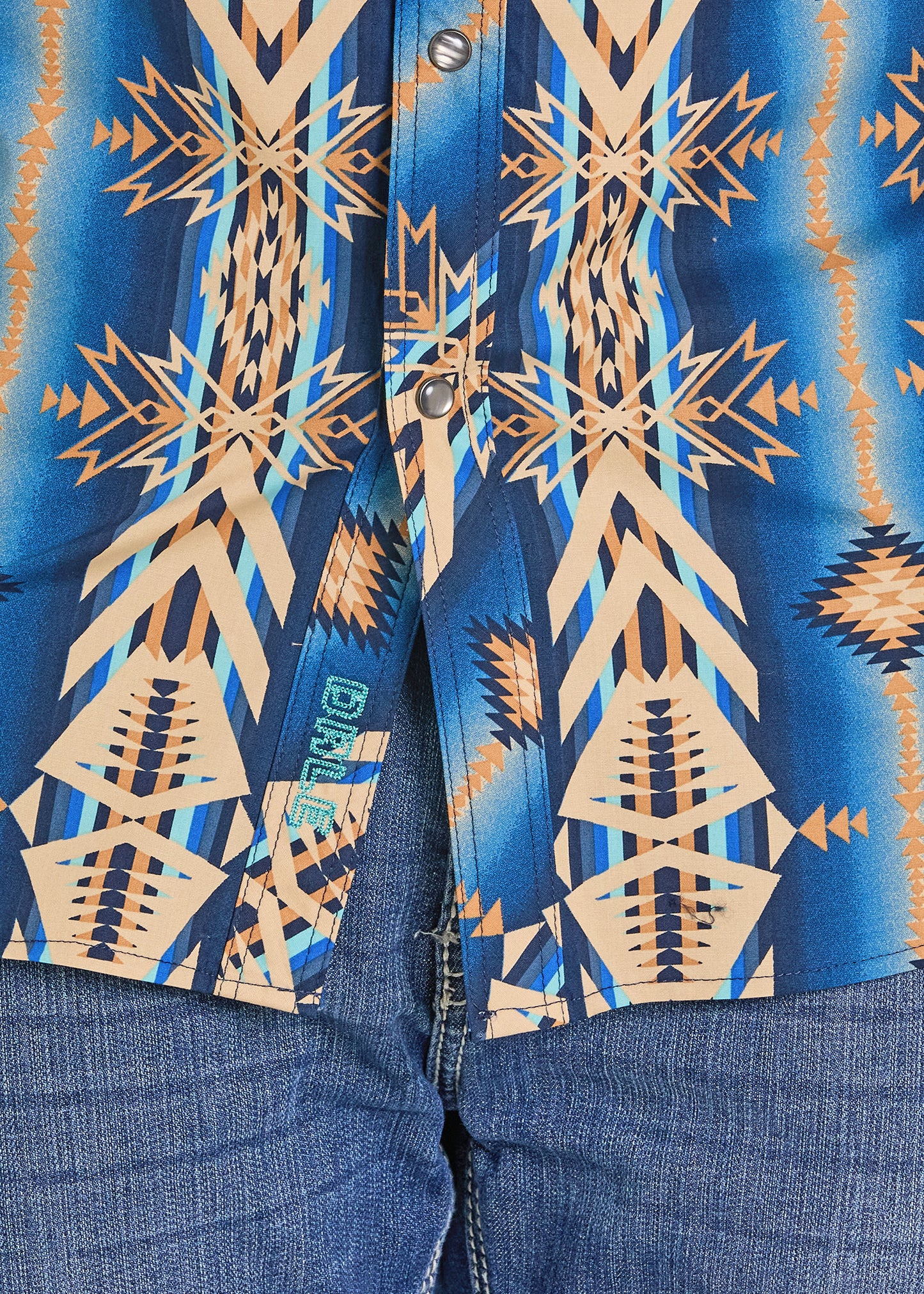Close-up of a blue shirt with geometric pattern