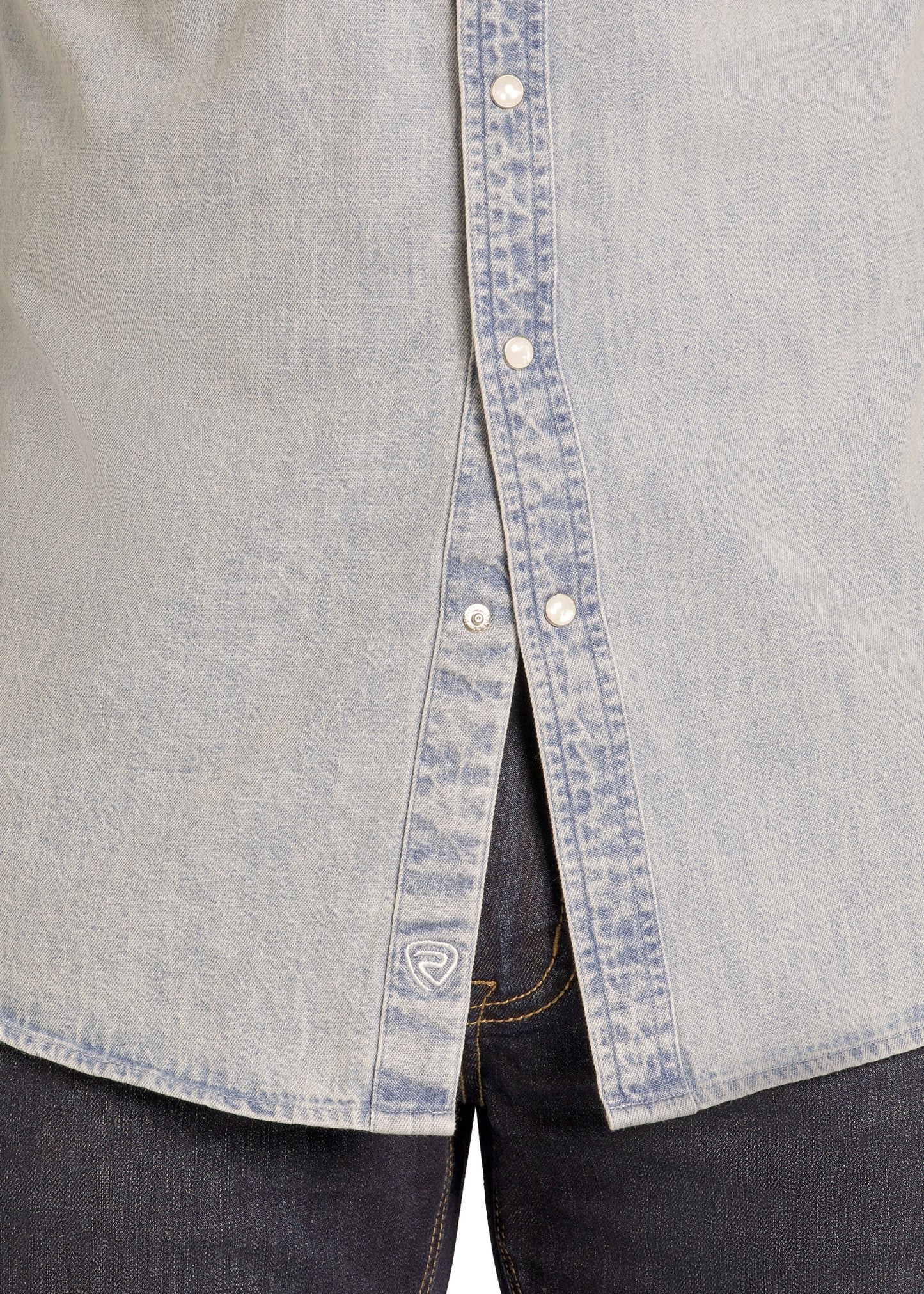 Close-up of a gray shirt with denim collar and trim, featuring a brand logo on the chest.