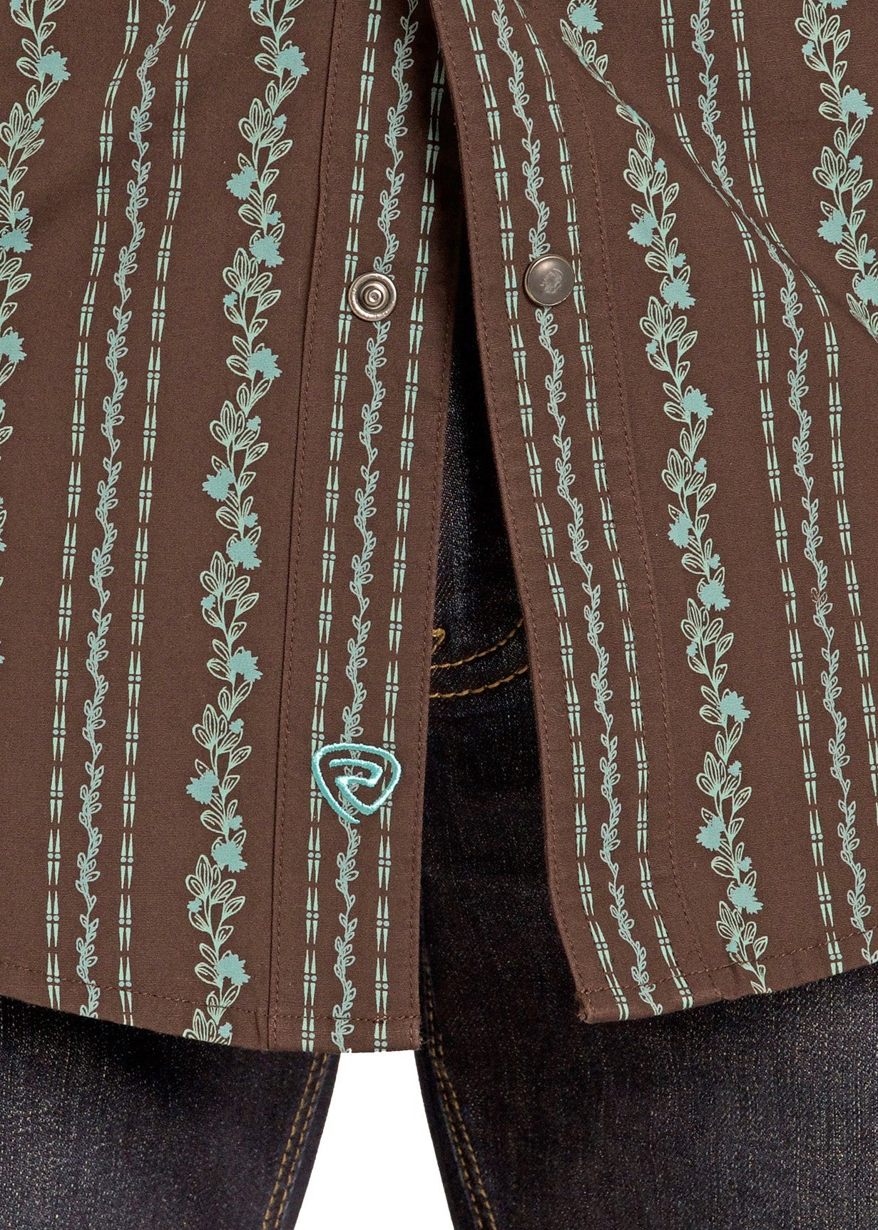 Close-up of a brown jacket with turquoise embroidery on a white background