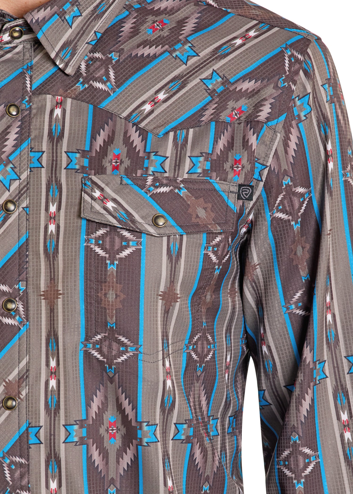 Close-up of a patterned shirt with blue and brown design