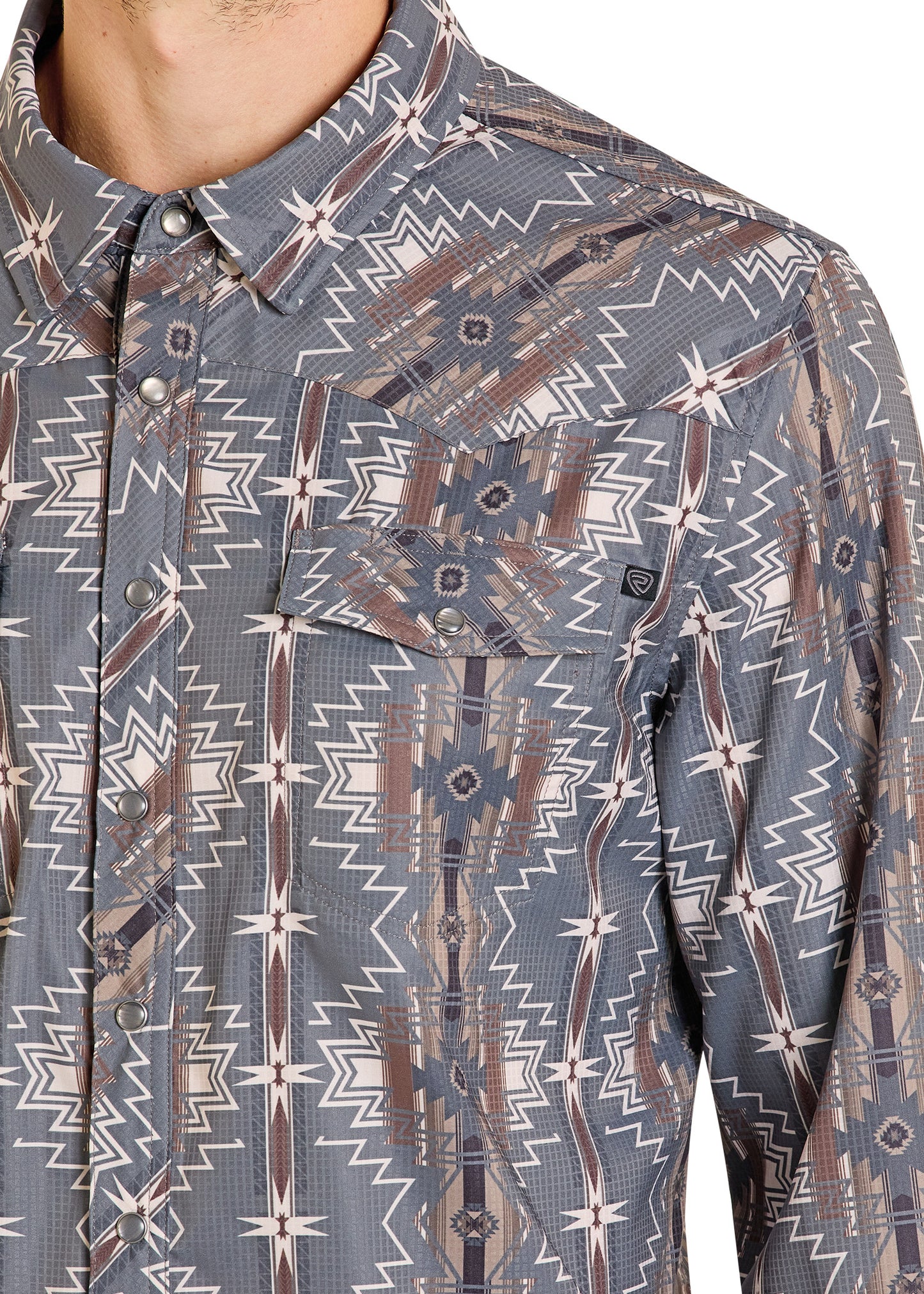 Close-up of a patterned shirt with geometric design on a white background