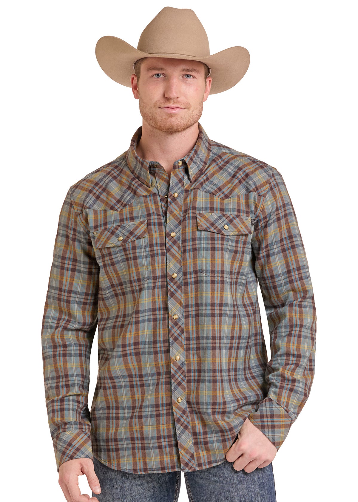 A man wearing a tan cowboy hat and a long-sleeve plaid western button-up shirt in brown, beige, and gray tones, paired with blue jeans, against a plain white background.
