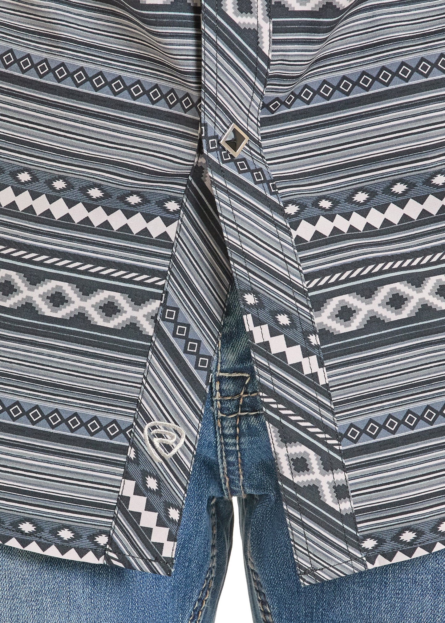 Close-up of a patterned shirt with black diamond snaps