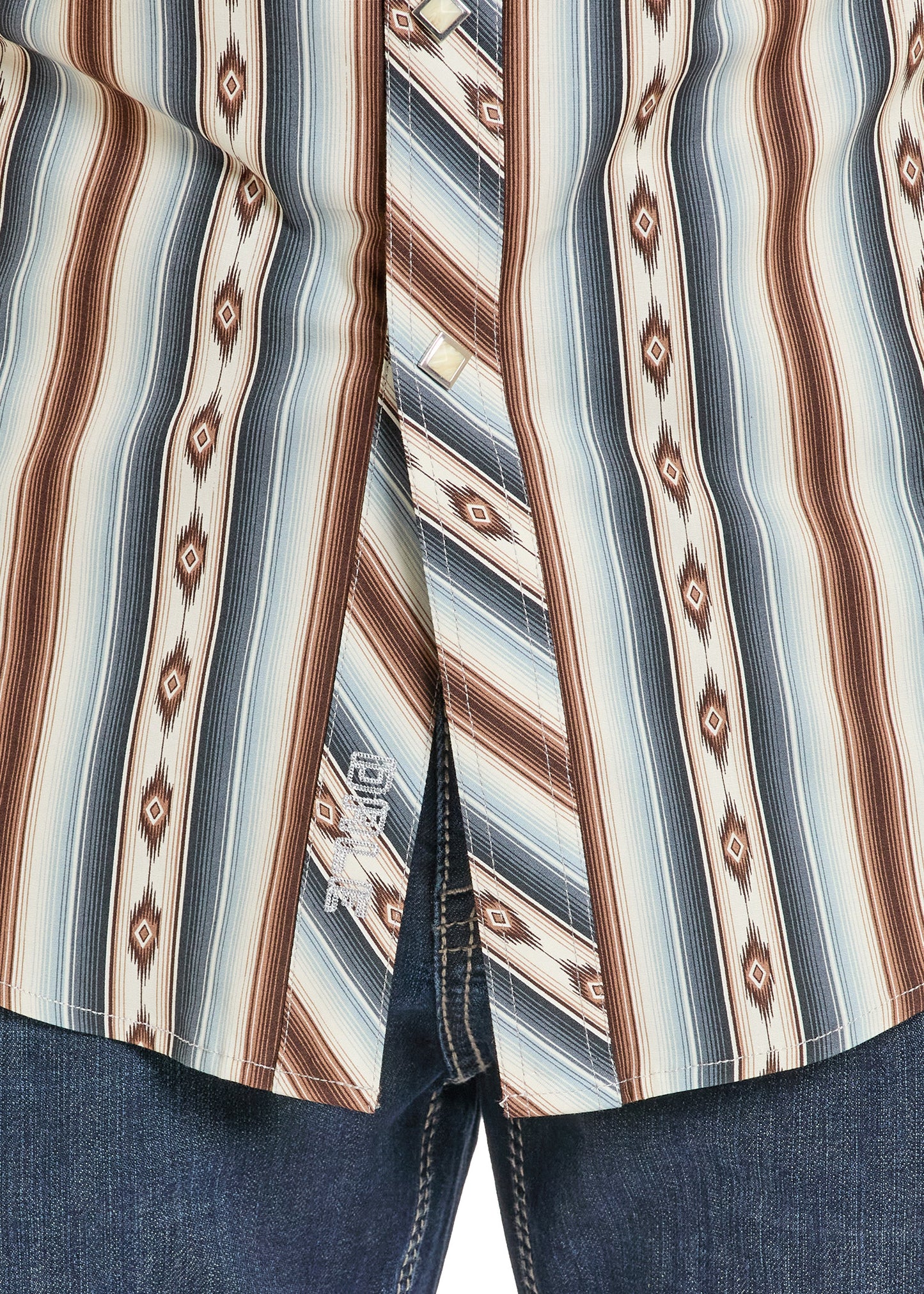 Close-up of a patterned shirt with vertical stripes in brown, blue, and beige.