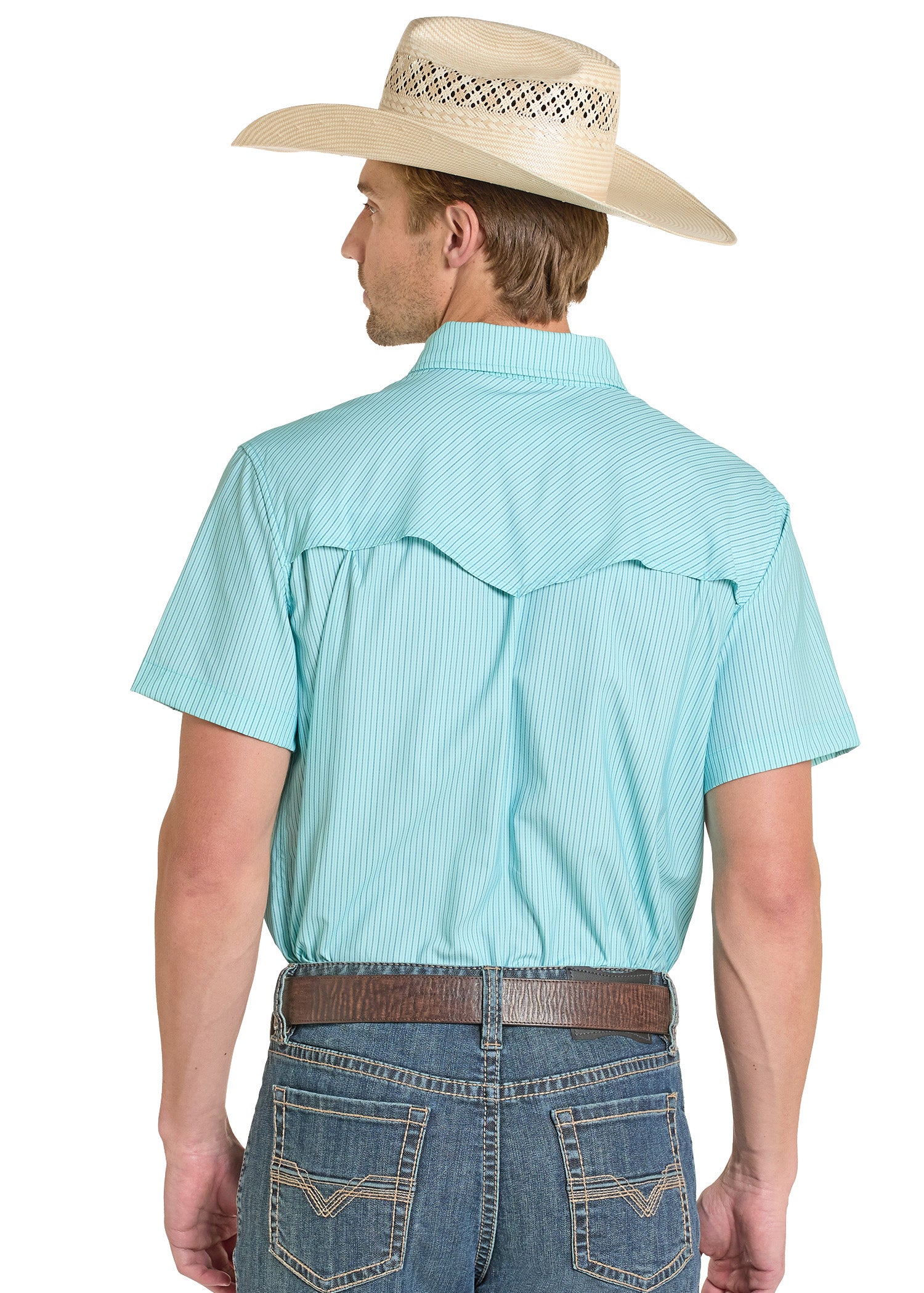 Man wearing a light blue short-sleeve shirt and denim jeans with a beige cowboy hat on a white background