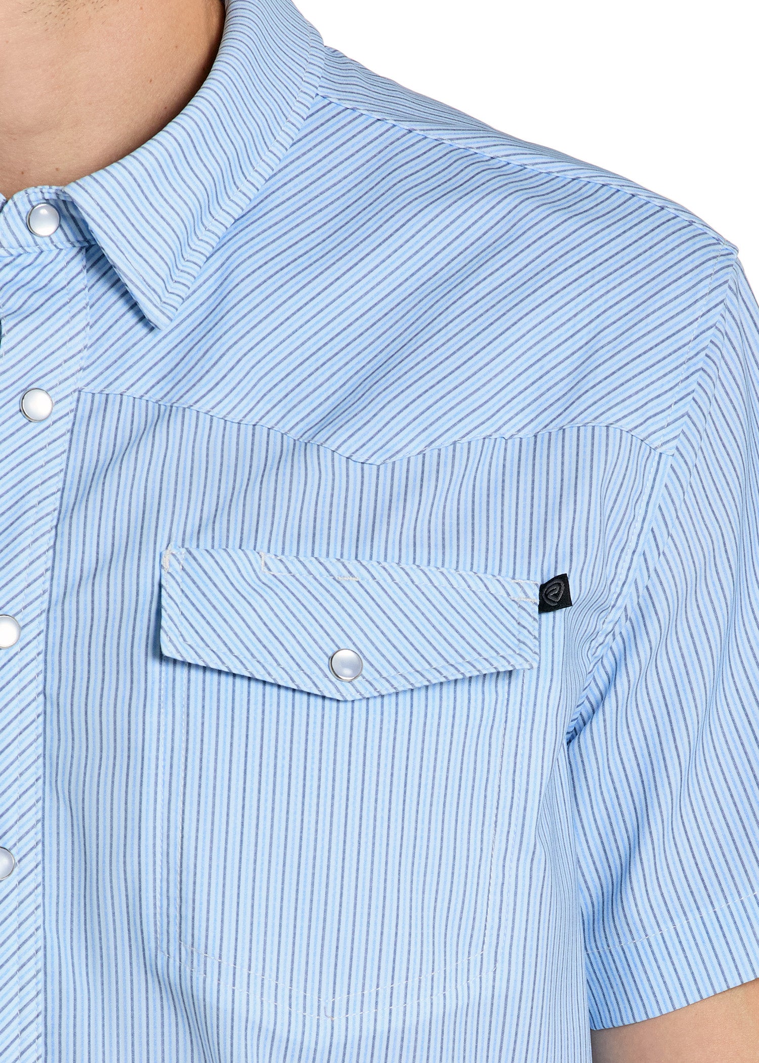 Close-up of a light blue striped shirt with a pocket and buttons.