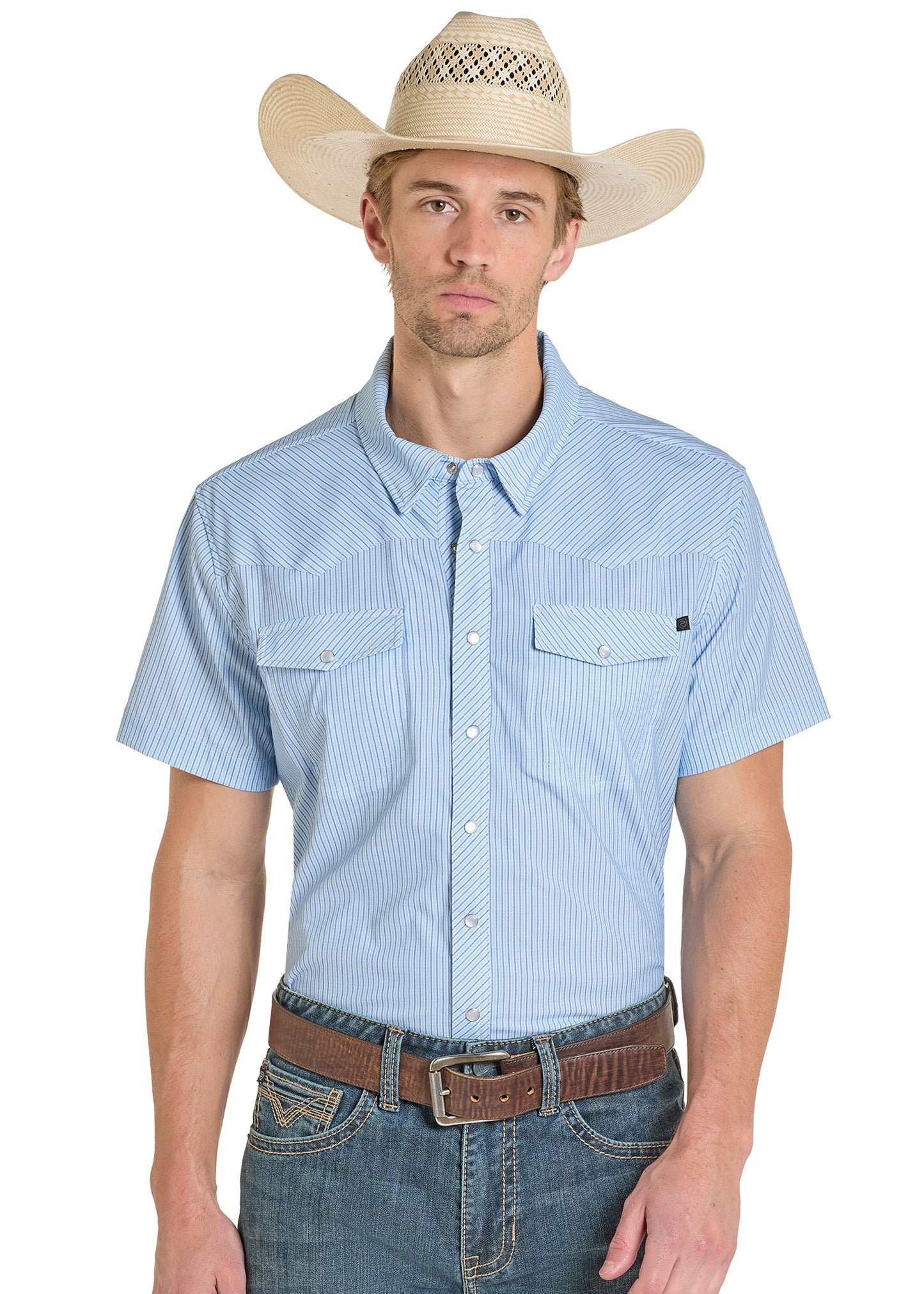 Man wearing a light blue short-sleeve shirt, denim jeans, and a beige cowboy hat on a white background
