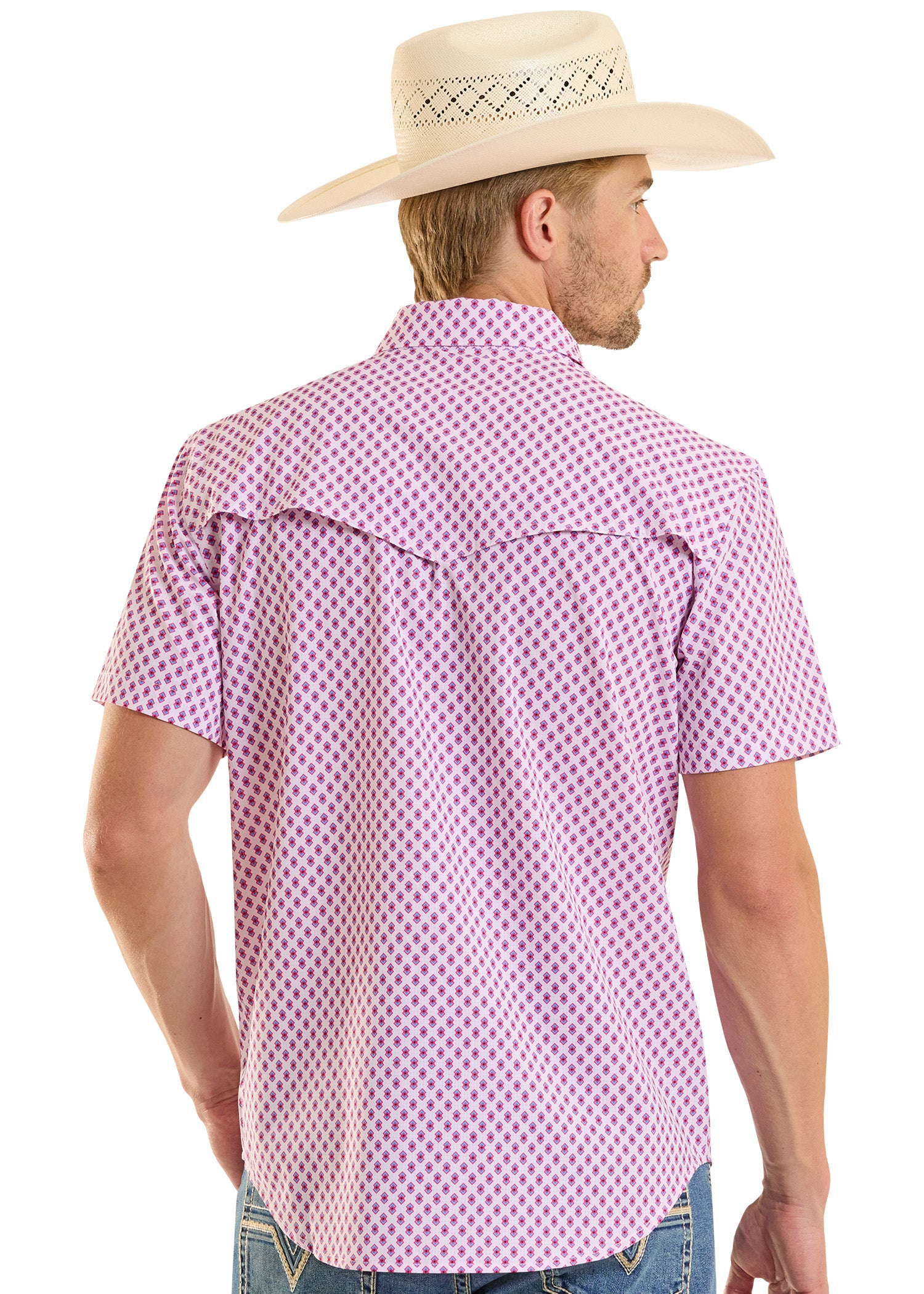 Man wearing a pink patterned shirt and cowboy hat on a white background
