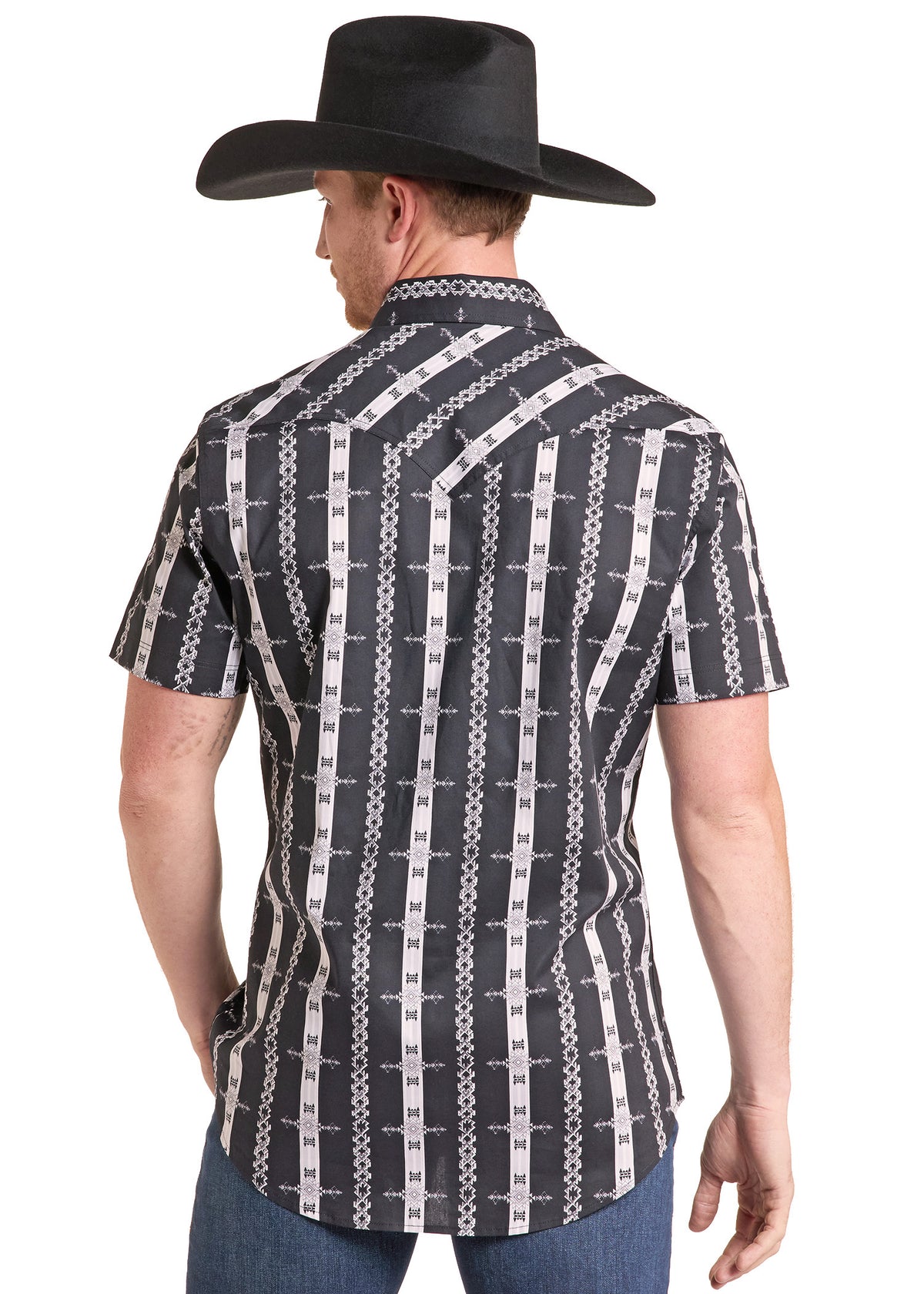 A man wearing a black cowboy hat and a short-sleeve western shirt with a black, white, and gray chain-link pattern, shown from the back against a white background.