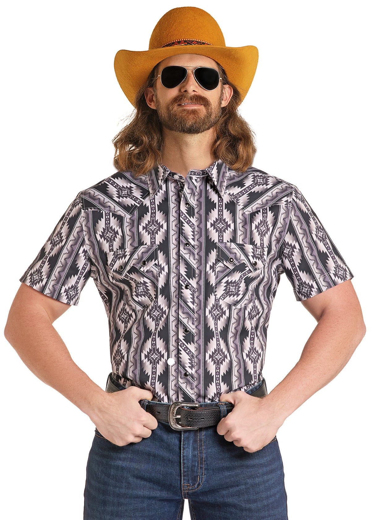 Dale Brisby wearing a short sleeve black aztec shirt.