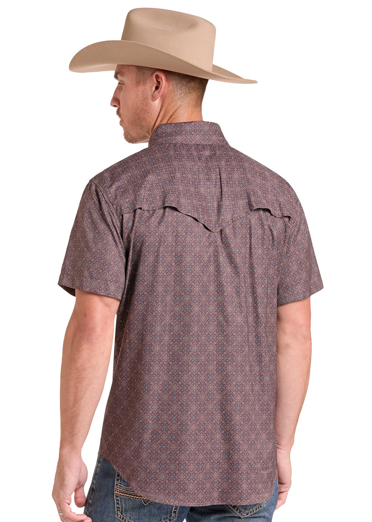 A man wearing a tan cowboy hat and a short-sleeve western shirt with a subtle geometric pattern, shown from the back against a white background.