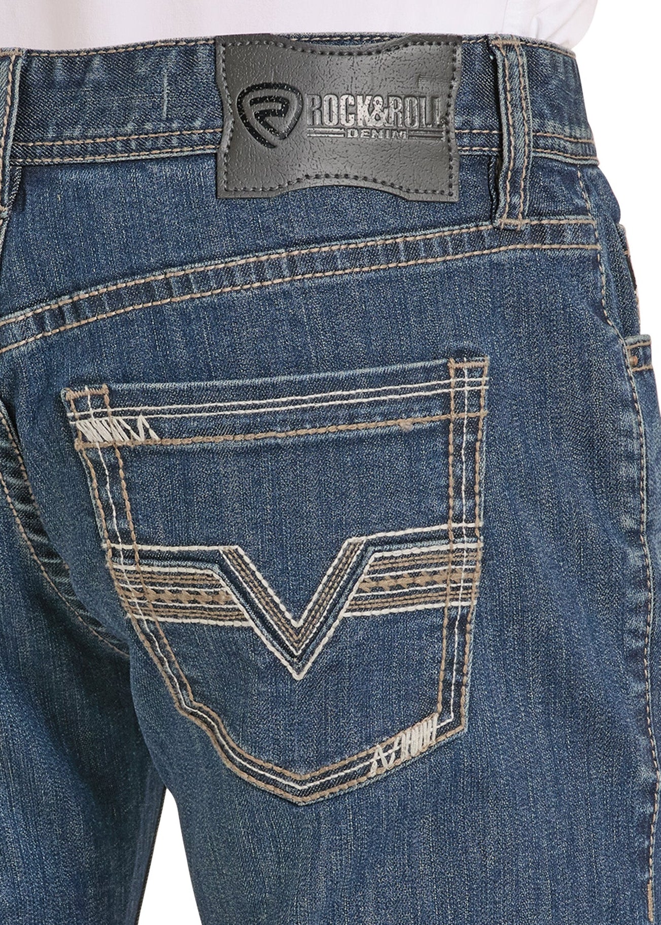 Close-up of blue jeans with a brand label on a white background