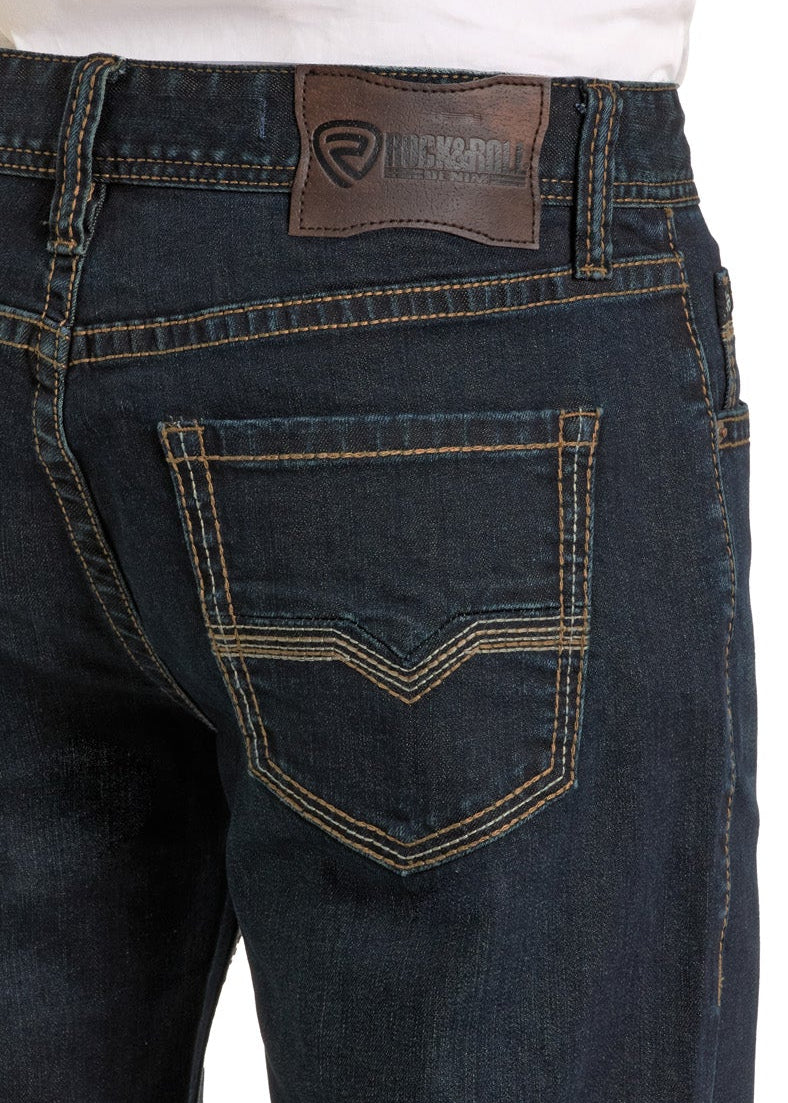 Dark blue jeans with a visible brand logo on a white background