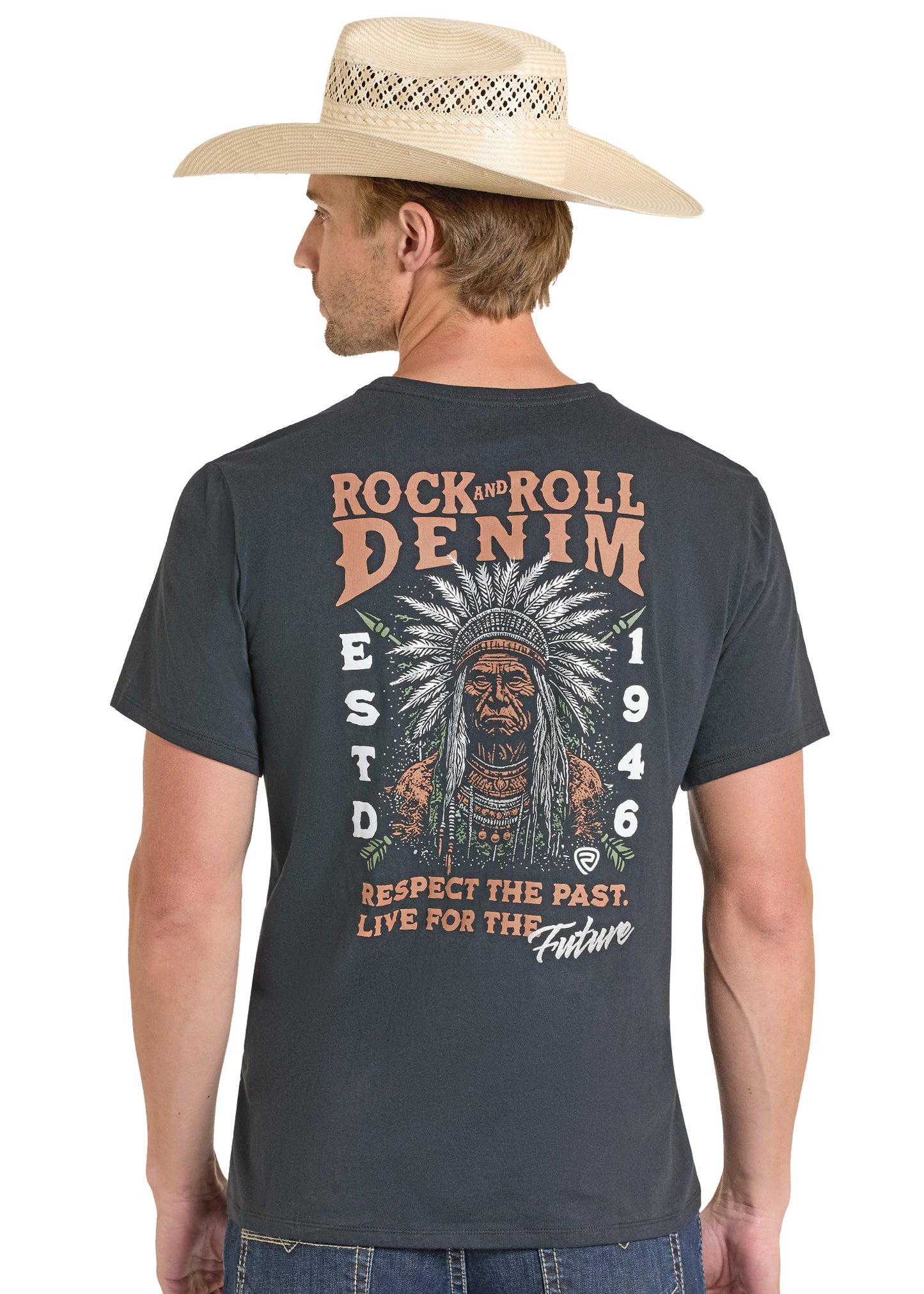 Man wearing a dark gray t-shirt with a graphic design and text, standing against a white background.