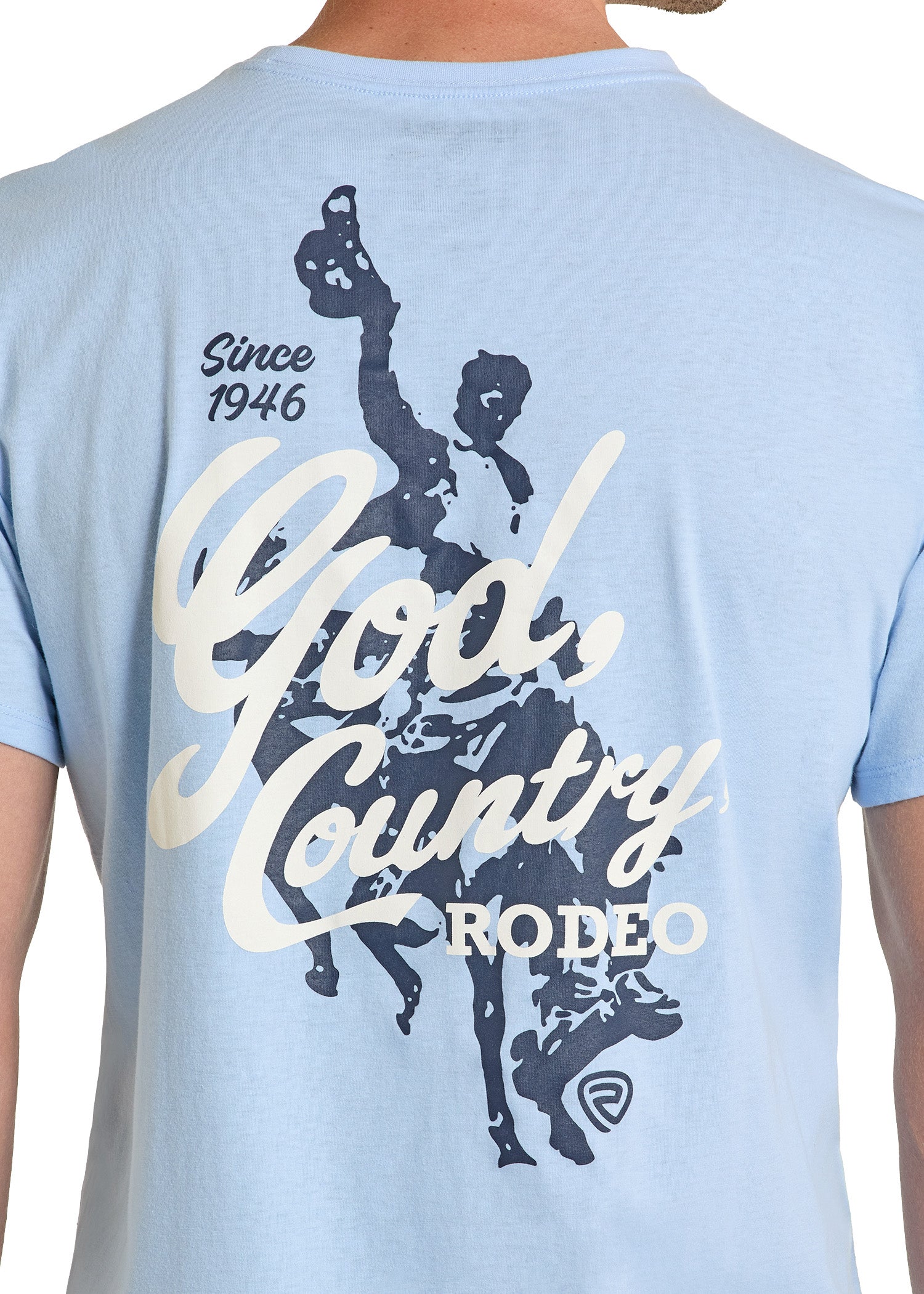 Light blue t-shirt with 'God Country Rodeo' graphic on a person wearing it.