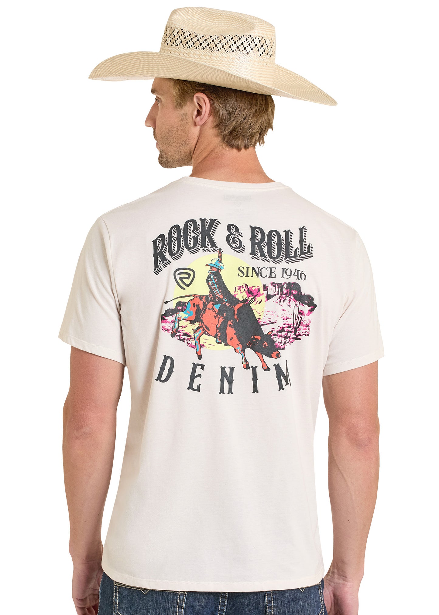 Man wearing a beige cowboy hat and a white t-shirt with a graphic design and text.