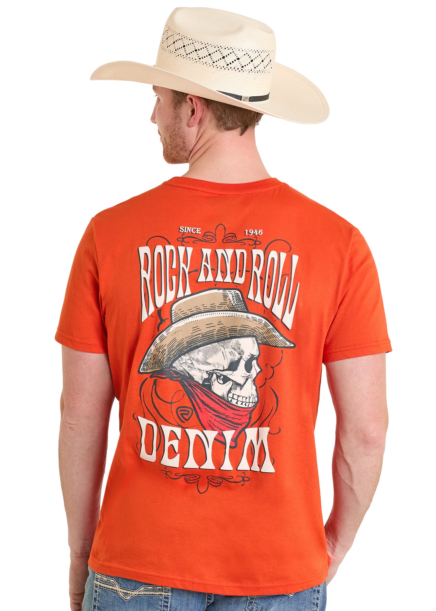 Man wearing an orange t-shirt with a graphic design and a cowboy hat on a white background