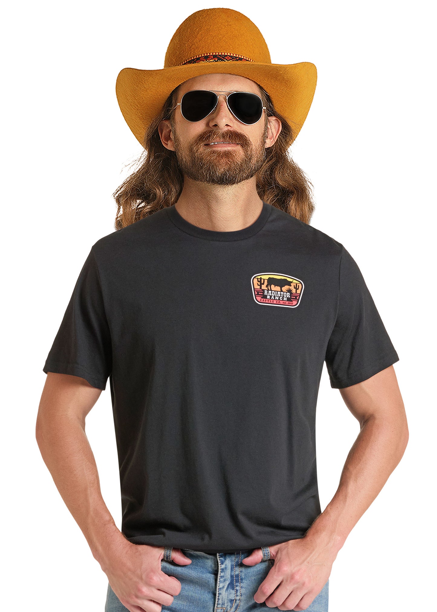 A man wearing a black crewneck t-shirt with a 'The Lone Ranger' chest graphic, styled with a yellow cowboy hat, sunglasses, and blue jeans against a white background.