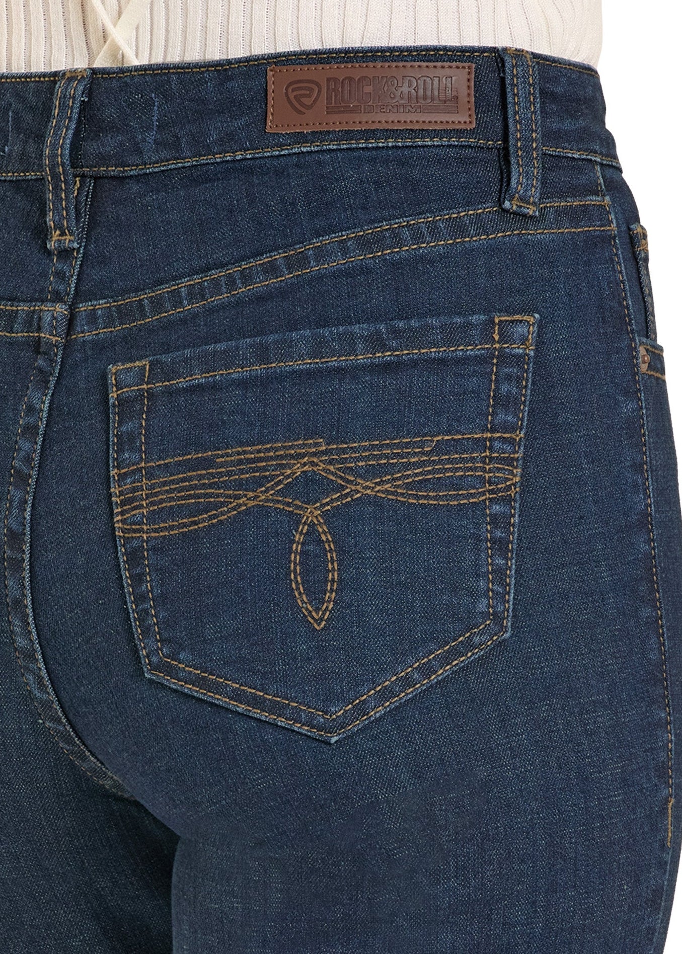 Close-up of blue jeans with a brand logo on the pocket area.