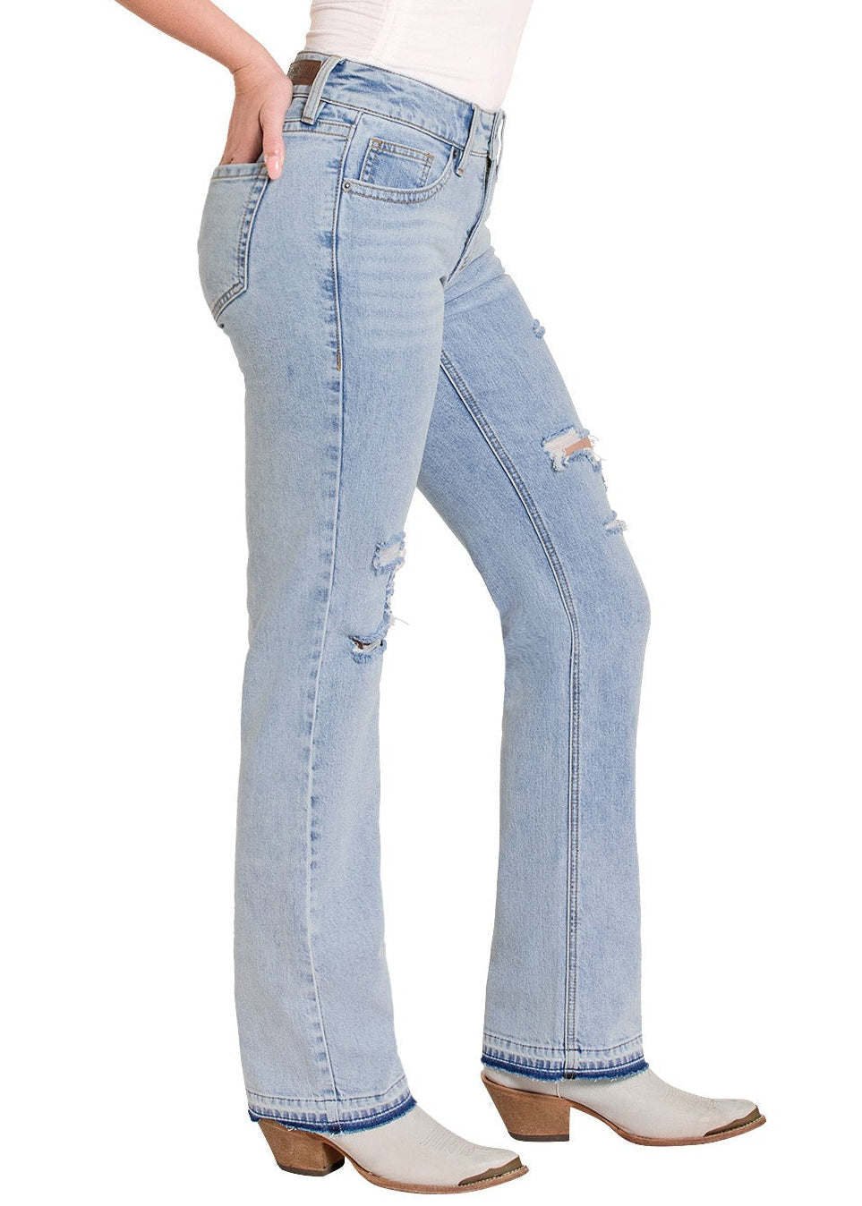 Woman wearing light blue jeans and a white tank top with a cowboy hat on a white background