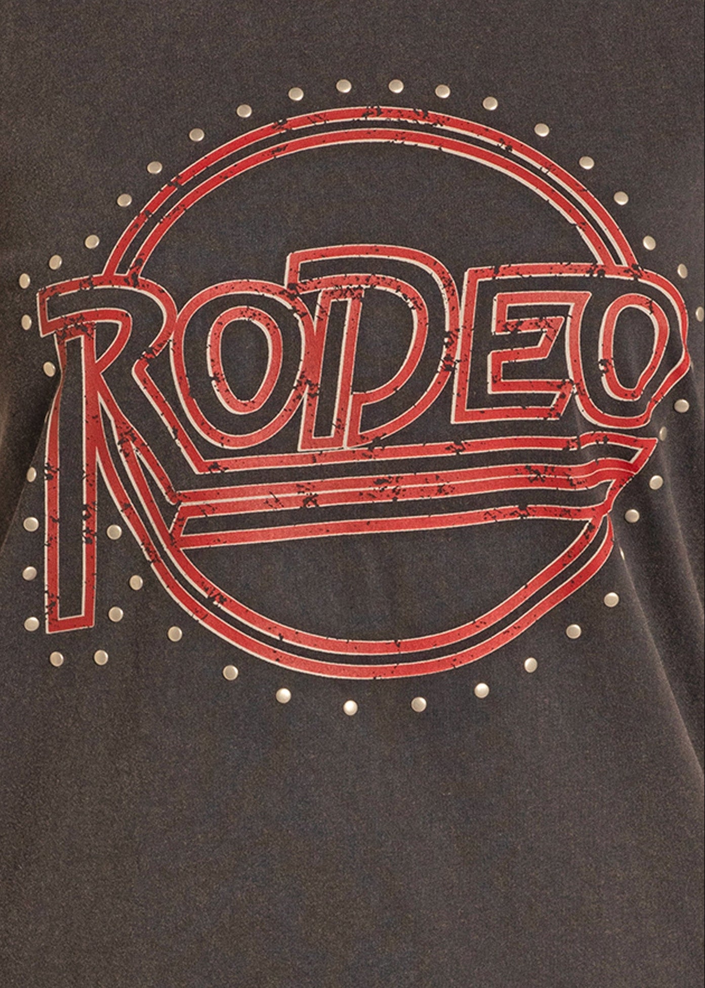 Black t-shirt with red 'Rodeo' logo and barbed wire design on a dark background