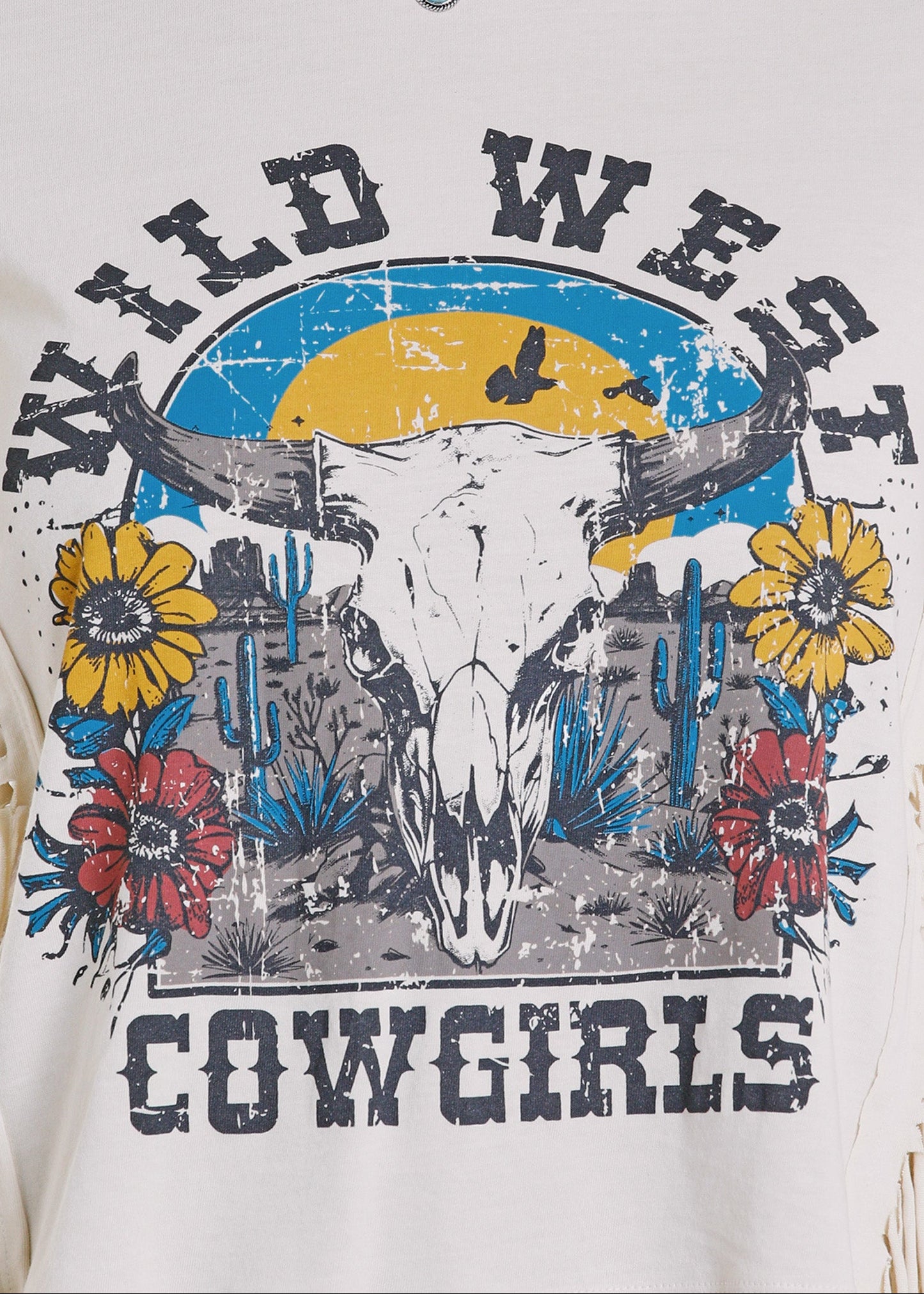 T-shirt with a graphic design of a cow skull, flowers, and text 'Wild West Cowgirls' on a white background.