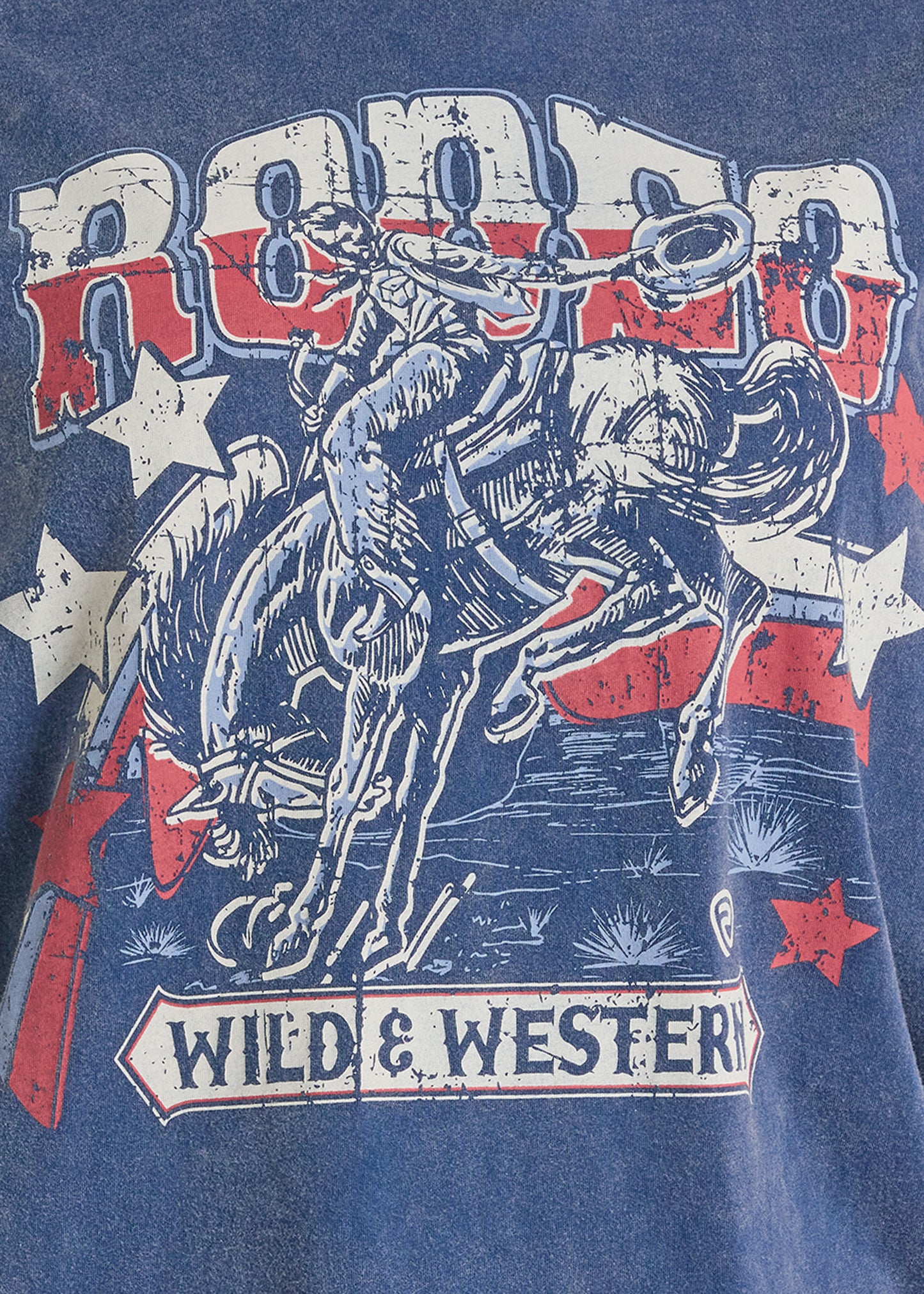 T-shirt with a graphic of a cowboy riding a bucking bronco and the text 'Rodeo' and 'Wild & Western' on a blue background.
