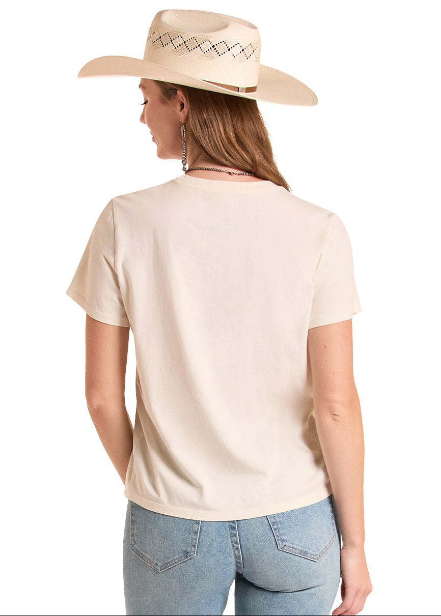 Woman wearing a beige shirt and light blue jeans on a white background