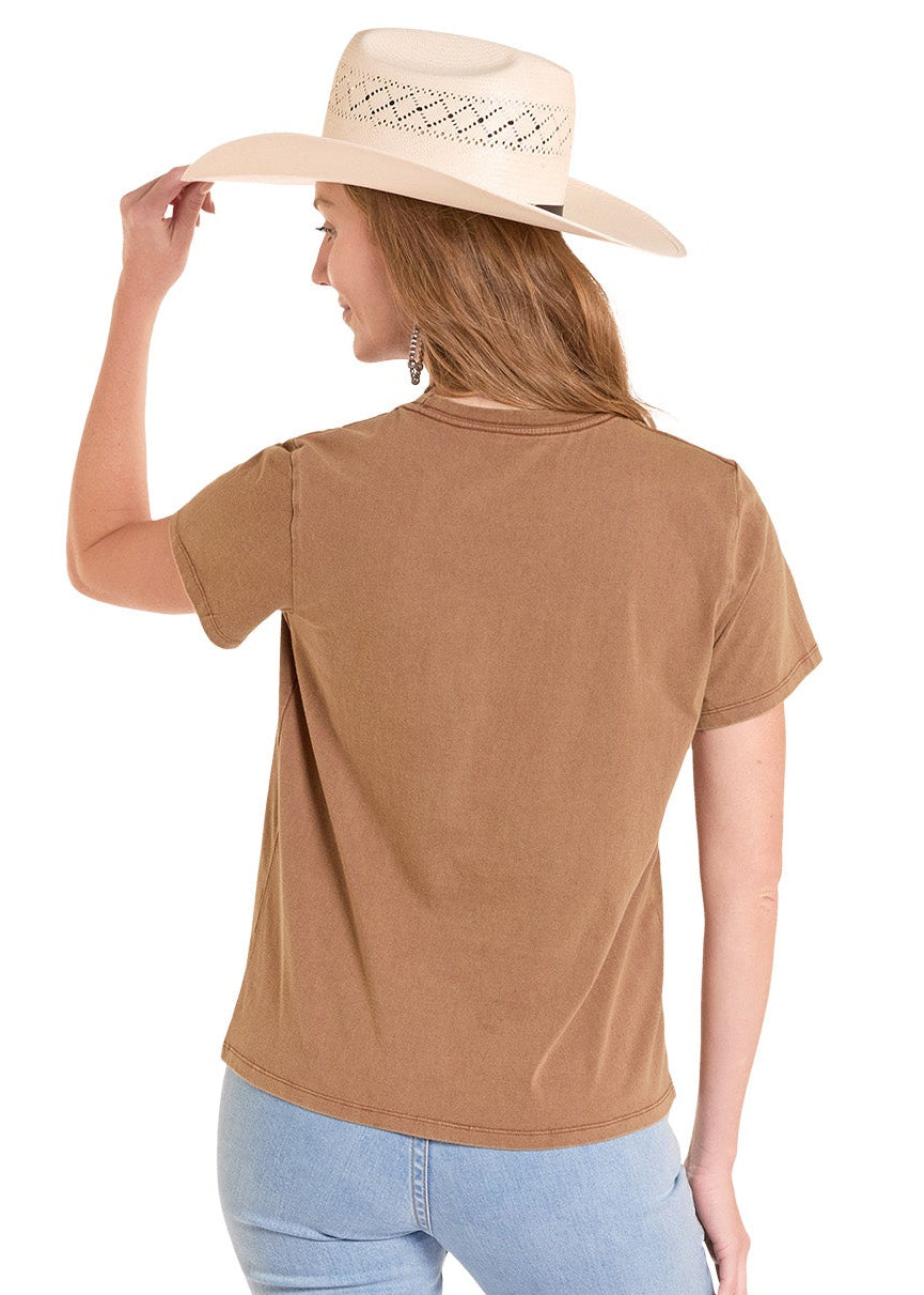 Woman wearing a brown t-shirt and light blue jeans with a beige hat on a white background