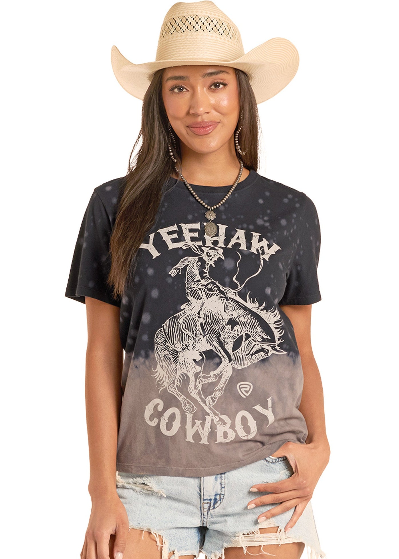 Woman wearing a black t-shirt with 'Yeehaw Cowboy' text and graphic, denim shorts, and a straw cowboy hat.