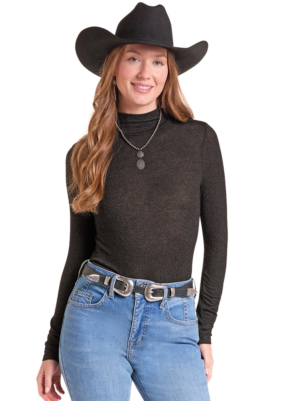 A woman modeling a dark brown ribbed long-sleeve mock neck top, styled with a black cowboy hat, silver necklace, and blue jeans against a white background.