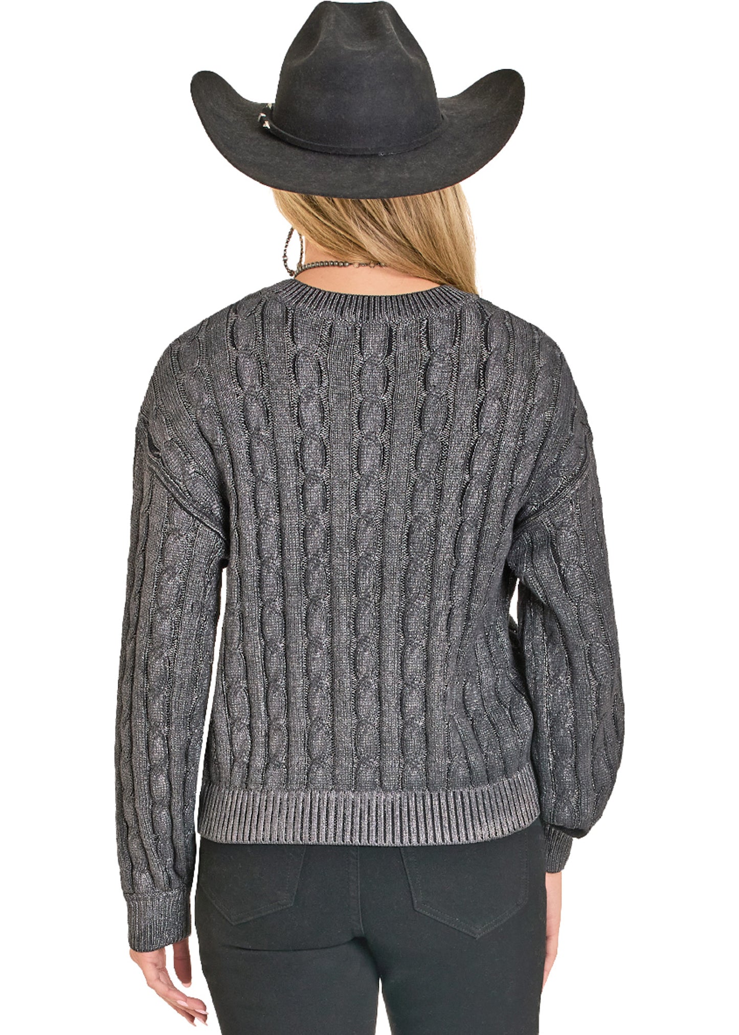 A person is shown from the back against a white background, wearing a black cowboy hat, black pants, and the Rock & Roll Denim Foil Cable Knit Sweater.
