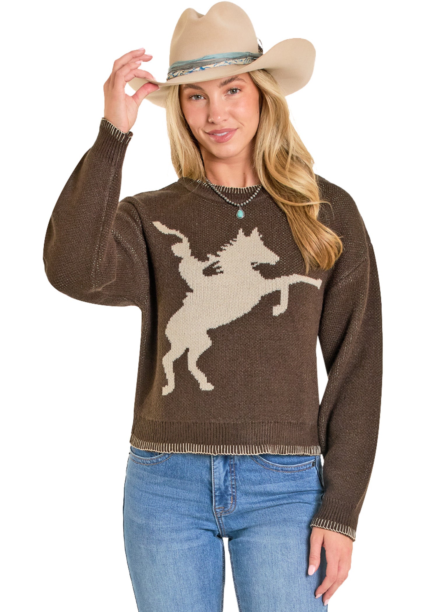 Women in brown sweater with knitted fabric with a white horse design on a brown background