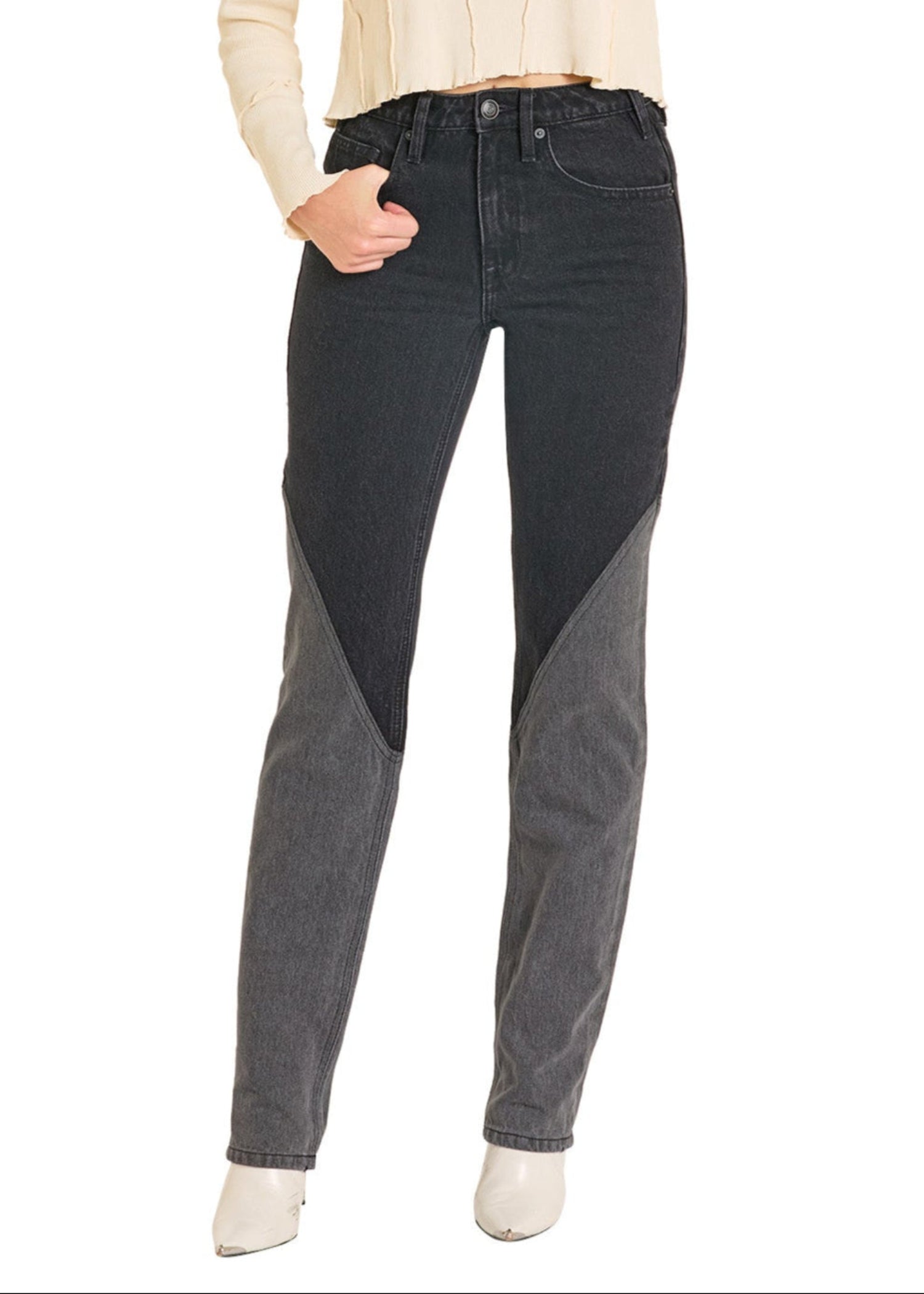 Black jeans worn by a person on a white background