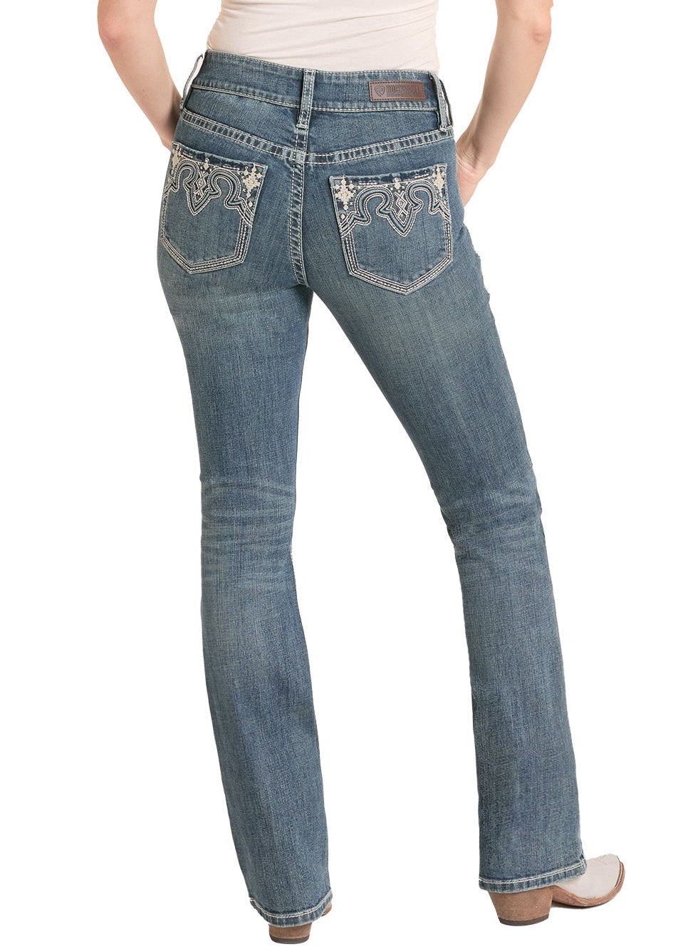 Woman wearing blue jeans and a white tank top with a cowboy hat on a white background