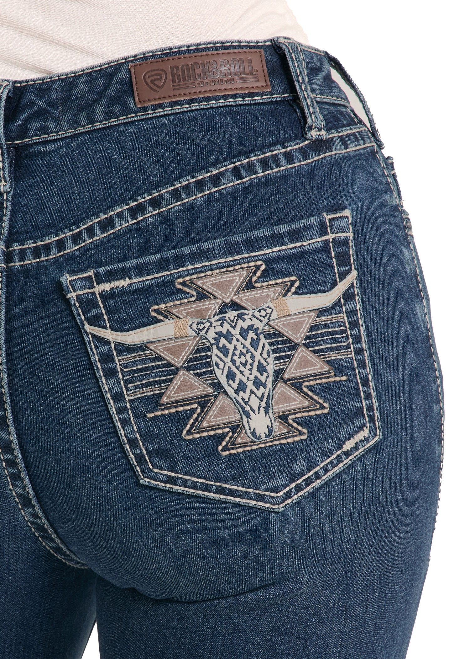 Blue jeans with a geometric pattern on the back pocket, featuring the Rock & Roll Cowboy brand.