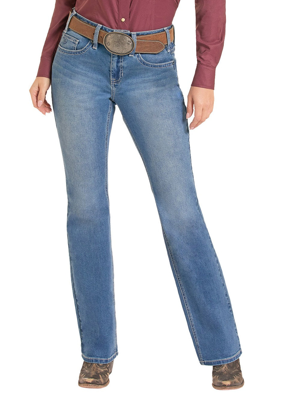 A woman modeling a western outfit consisting of a long-sleeve maroon button-down shirt, blue jeans, a brown belt, a patterned neck gaiter, and a tan cowboy hat, set against a plain white background.