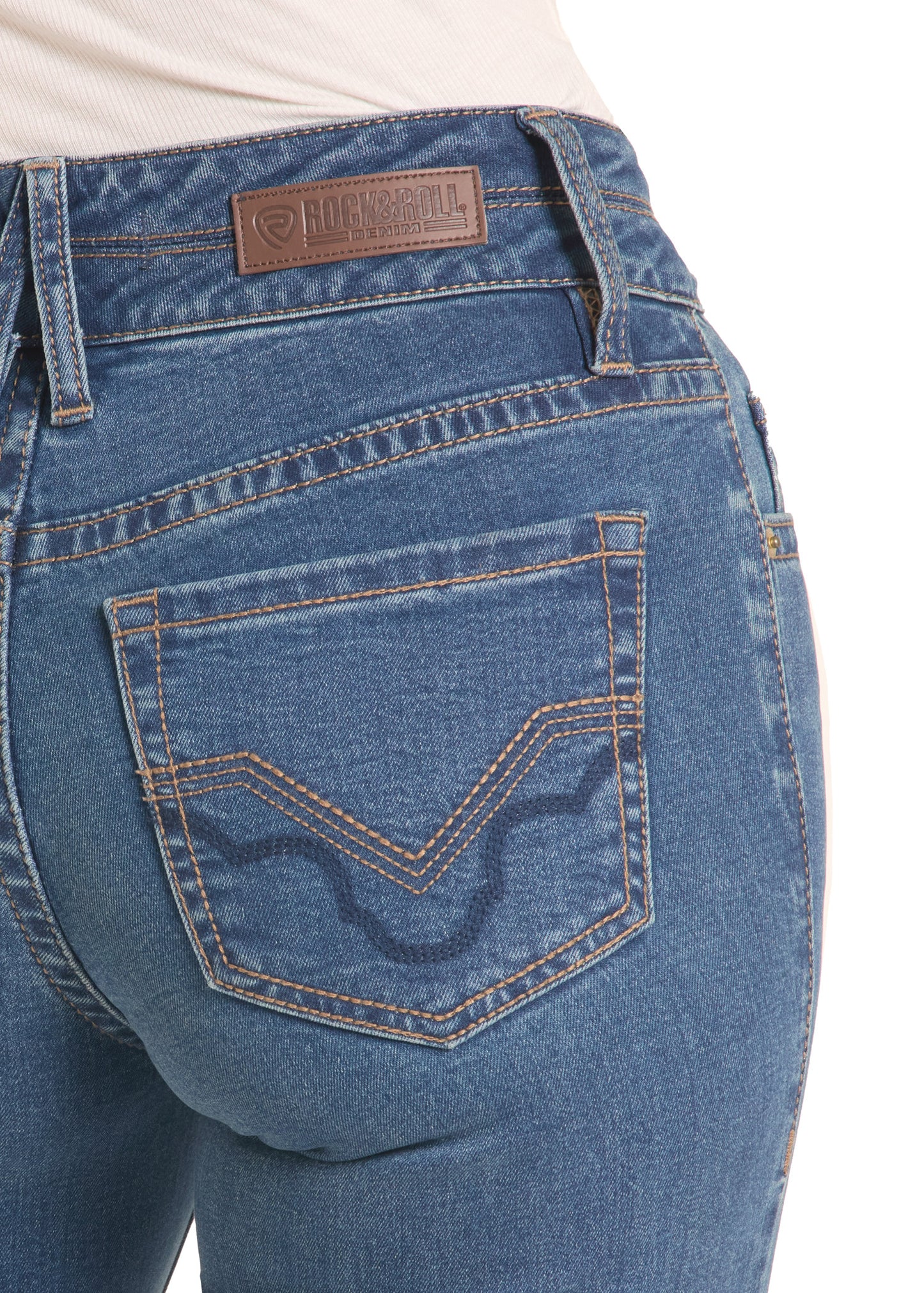 Close-up of blue jeans with a brand label on a white background