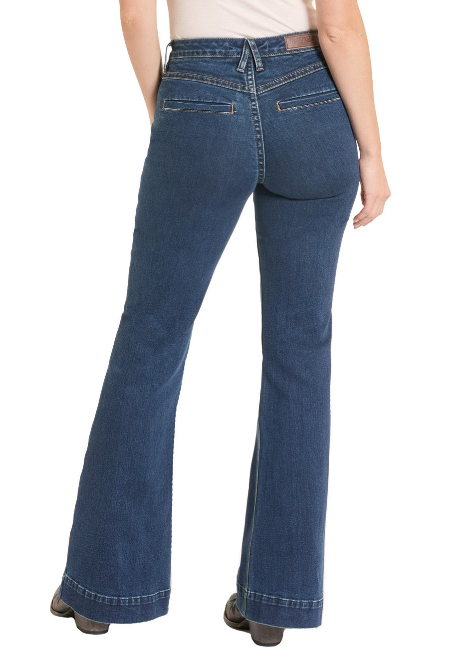 Person wearing blue jeans and a white shirt with a beige cowboy hat on a white background