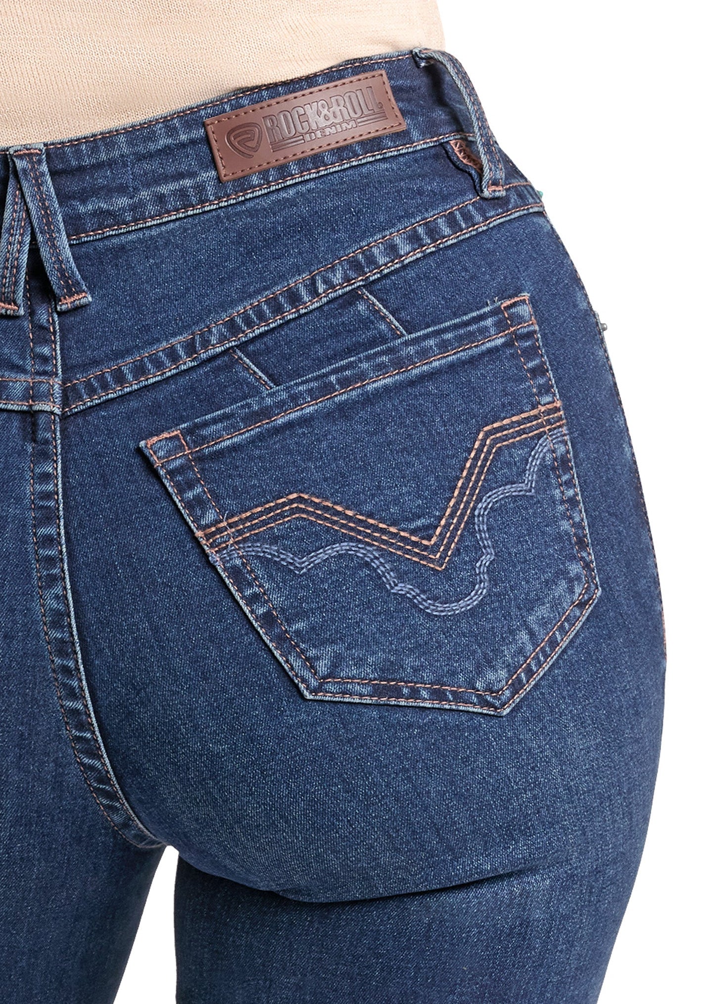 Close-up of the back waistband and rear pocket of blue denim jeans, showing a brown leather Hanes brand patch and decorative contrast stitching.