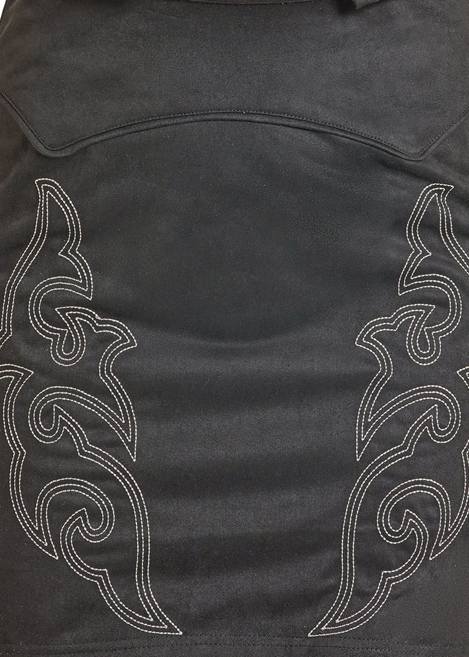 Black leather jacket with white tribal patterns on a dark background
