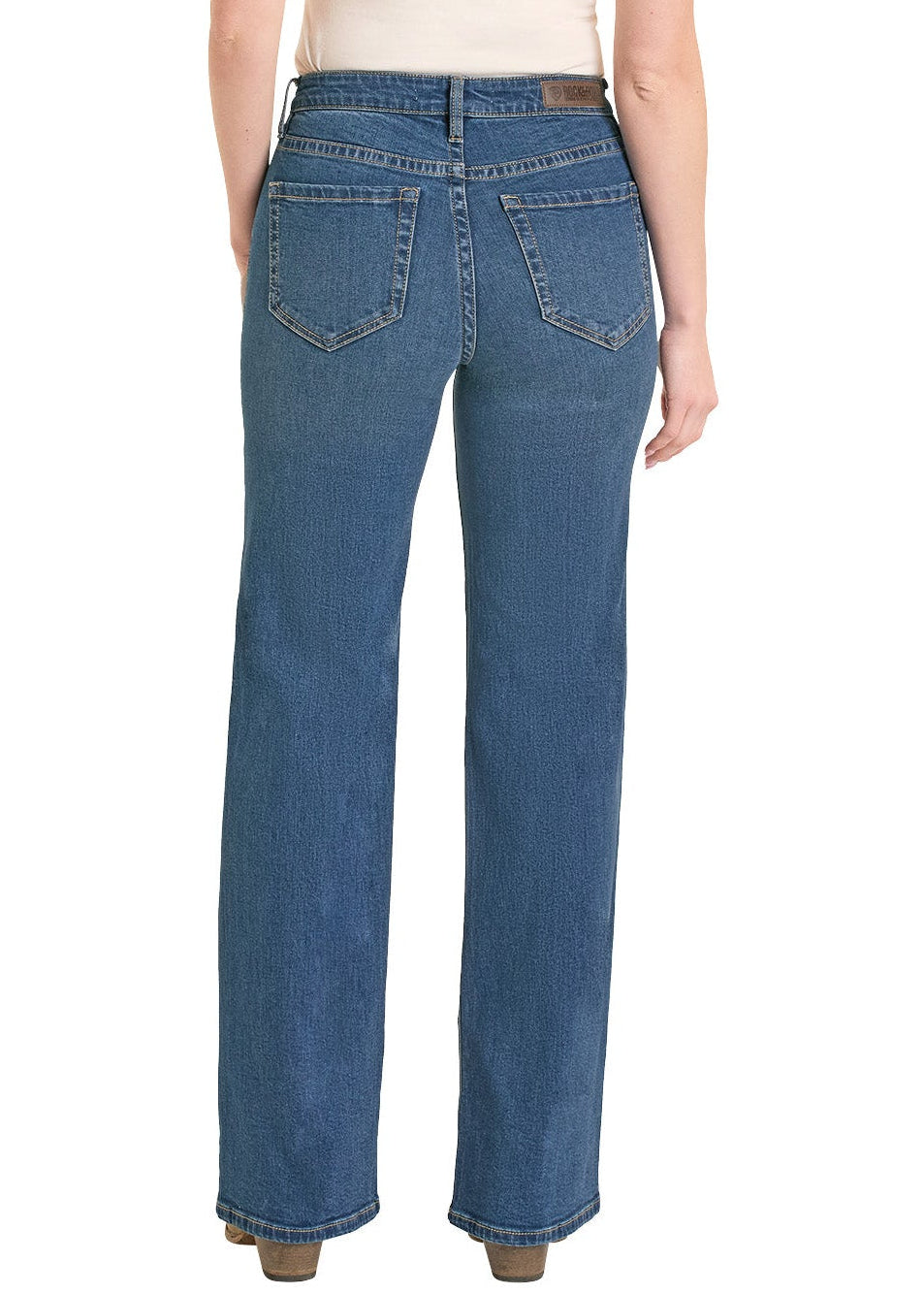 Woman wearing blue jeans and a beige cowboy hat on a white background