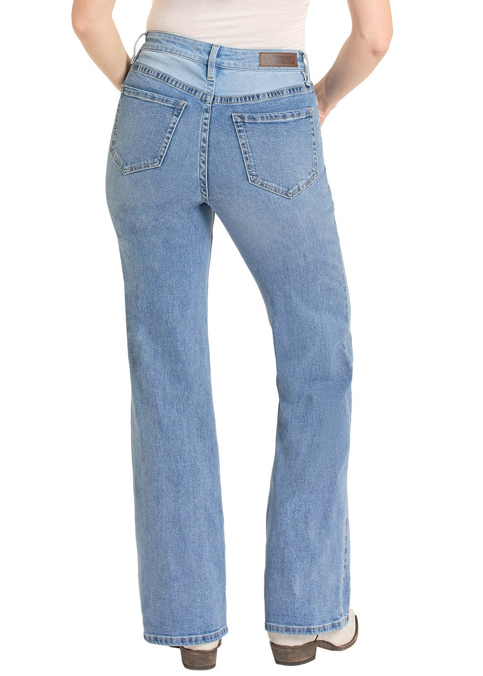 Woman wearing blue jeans and a beige hat on a white background