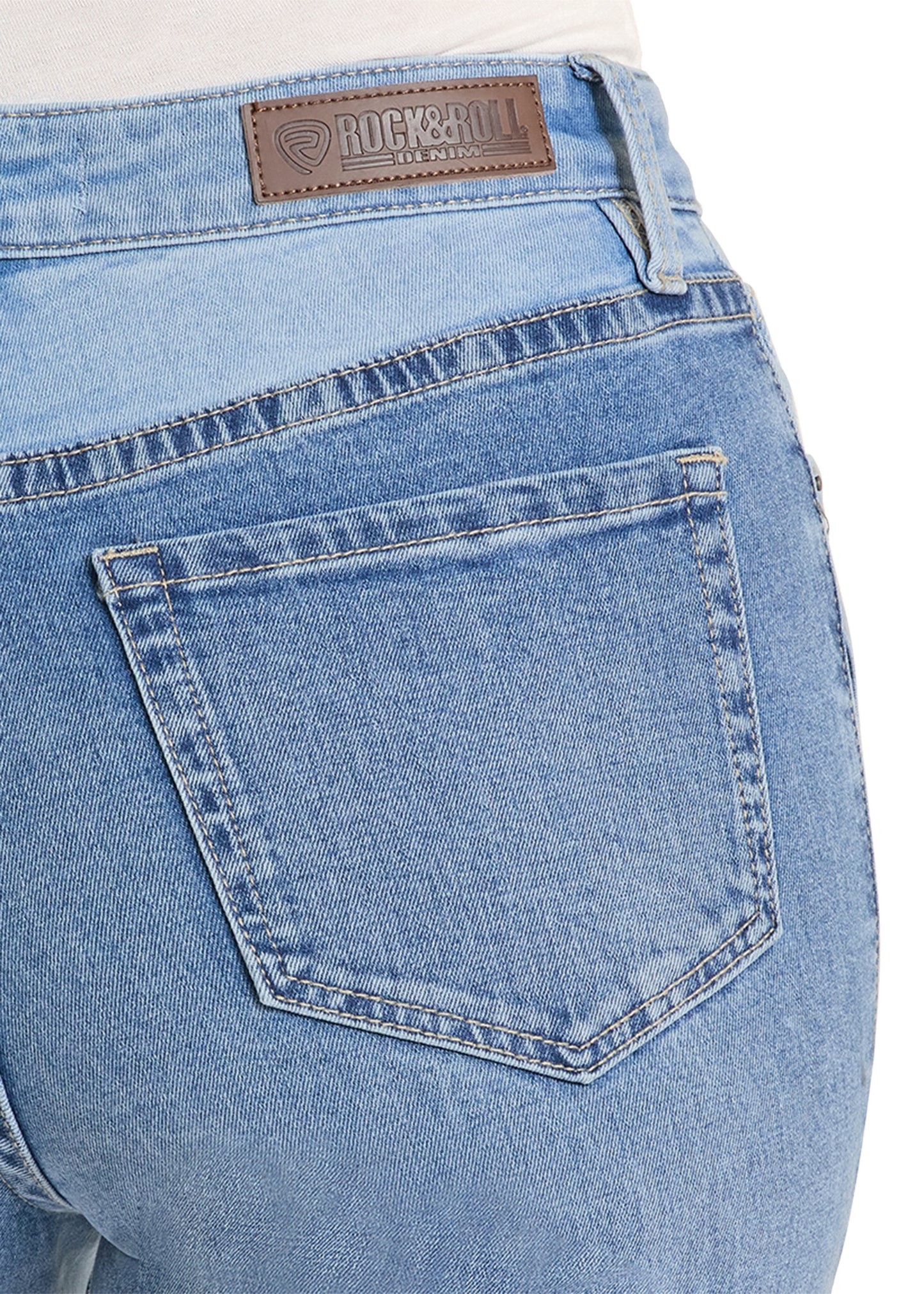Close-up of blue jeans with a brand label on a white background